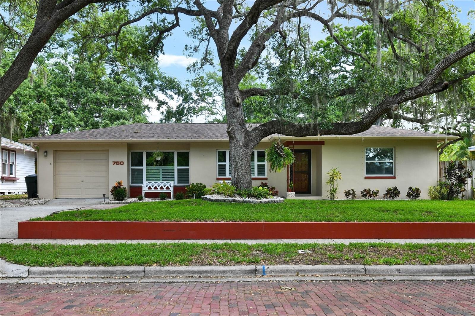 Pride of Ownership and Location! Location! This Beautifully and Extensively Updated Mid-Century home in Move-In-Condition is located on a charming brick street and only a short walk to downtown Dunedin. Upon entering you’ll love the openness of the floor plan, the newer flooring and the split bedroom layout. The updated eat-in kitchen features Newer Wood Cabinetry, Quartz Counter Surfaces and Stainless Steel Appliances. The master bedroom is large enough to accommodate a king-sized bed and furniture. The secondary bedrooms are ample sized as well. The Kitchen opens to a separate den/office and a 15 x 21 enclosed Lanai with a newer (included) Hot Tub.  The (.21 acre) lot features a spacious backyard which will accommodate a future pool or addition. The garden area is perfect for outdoor entertaining with Mature Trees for Shade and a 6" privacy fence. Upgrades include Newer Roof, Windows & A/C. Not in a flood or evacuation zone. No HOA or CDD. Hurry! This home is Priced to Sell!!!