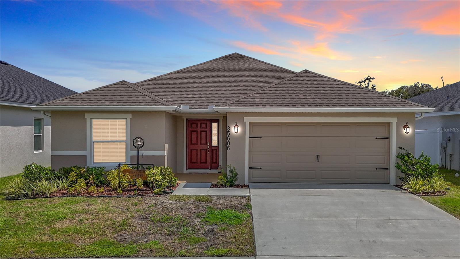 Welcome to modern living in the heart of the Chapel Creek community in Pasco County. Built in 2023 by Highland Homes, this nearly new 4-bedroom, 2-bath residence features the highly sought-after Serendipity floor plan—offering over 2,000 square feet of smart, stylish, and functional living space. Step inside to an open-concept layout that blends the kitchen, living, and dining areas—ideal for everyday life, entertaining guests, or simply staying connected. The kitchen is a standout with QUARTZ COUNTERTOPS, stainless steel appliances, contemporary cabinetry, and an OVERSIZED central island perfect for gathering with family and friends. And unlike many newer homes where the pantry is an afterthought, this one delivers: a MASSIVE WALK-IN PANTRY that’s ready to take on your biggest hauls from Costco, Sam’s Club, AND BJ’s—yes, all at once. The spacious primary suite features a walk-in closet and an en-suite bath with DUAL VANITIES and a walk-in shower, creating a private retreat after a long day. Three additional bedrooms offer flexibility for a home office, guest space, fitness room, or whatever your lifestyle demands.  Situated on a PREMIUM WATER VIEW lot, you’ll enjoy peaceful mornings and relaxing evenings on the screened-in lanai, taking in TRANQUIL VIEWS of the pond and surrounding wildlife.  Designed with today’s homeowner in mind, this home includes energy-efficient construction, modern finishes, and low-maintenance materials inside and out. The Chapel Creek community offers a QUIET setting while remaining just minutes from local shops, restaurants, medical facilities, and key roadways like SR-54, US-301, and I-75—making your daily commute or weekend plans a breeze.  If you're looking for a move-in-ready home that combines thoughtful design, flexible space, and lifestyle-friendly features, 35606 Bellington Boulevard checks ALL the boxes.
