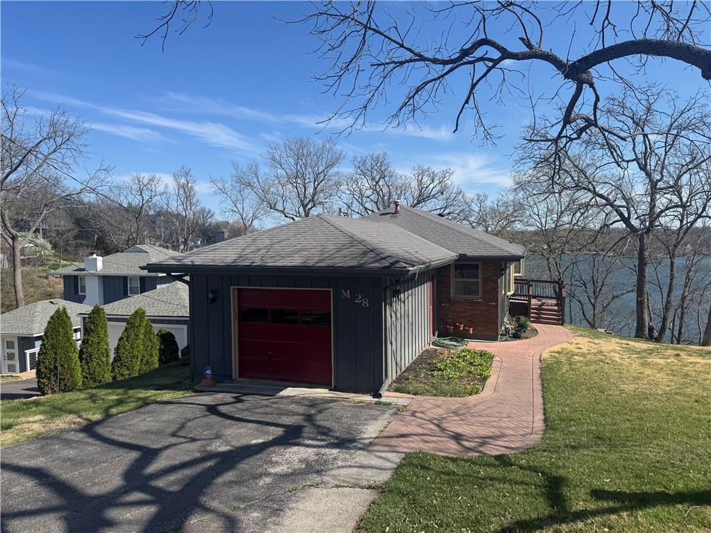 Welcome to 28 M Street, a captivating lakefront retreat nestled in the serene community of Lake Lotawana, Missouri. This spacious 3-bedroom, 3-bathroom home spans 1,638 square feet and is situated on a generous 9,410 square foot lot, offering ample space for relaxation and entertainment. -Redfin.com

As you enter, you’re greeted by an open-concept living area that seamlessly blends comfort and style. The well-appointed kitchen features modern appliances and ample cabinetry, making it a chef’s delight. The bedrooms are generously sized, providing peaceful sanctuaries for rest and rejuvenation.


One of the standout features of this property is its direct access to Lake Lotawana, the largest private lake in the Kansas City area, boasting 480 acres of surface water and 27 miles of shoreline. -LakeLotawana.org

  Imagine waking up to serene lake views and enjoying water-based activities such as boating, fishing, and sailing right from your backyard. The community is renowned for its vibrant sailing scene and hosts regular regattas, offering a unique lifestyle for water enthusiasts. -Therostgroup.com


Beyond the lake, the community offers a plethora of amenities, including ballfields, playgrounds, tennis courts, golf courses, and parks with hiking and bridle trails. -weichert.com



Experience the perfect blend of tranquility and community living at 28 M Street—a place where every day feels like a vacation. Don’t miss the opportunity to make this lakeside haven your new home.