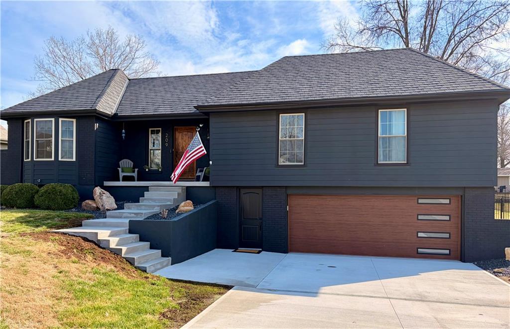 Beautifully updated has the perfect blend of modern upgrades, quality craftsmanship, and comfortable living—inside & out. Impressive exterior features a 50-yr composite roof and gutters (2024), smartboard siding with Tyvek wrap (2023), all newer double-pane, tilt-in windows for efficiency and easy maintenance. Sleek black steel fence. Large backyard w/newly added landscape boulders and 17 trees (2025). Brand-new concrete driveway, steps, and front porch (November 2025). New double garage door, & entry door. Updated interior with fresh paint throughout (2025), stunning solid oak floors, complemented by tile in the master bed and main bath. Open-concept living area features a custom wood vaulted ceiling, a cozy fireplace w/custom cabinetry & shelving, and a newer sliding glass door leading to the deck. Home includes upgraded closet systems, custom window coverings, & solid wood Knotty Alder doors throughout. The chef’s farmhouse kitchen is a true showstopper, complete with granite countertops, a large island with seating for 4–5, double sinks, and six electrical outlets. High-end stainless steel appliances include a Bosch gas cooktop with custom hood vented through the roof, built-in oven, dishwasher, microwave, and an LG refrigerator with dual ice makers. Custom cabinetry offers abundant storage w/soft-close features, pullout spice racks, under-cabinet lighting, an appliance garage, & decorative lit display cabinets. A beautiful copper farmhouse sink sits beneath the window. Primary suite includes a full bath with a walk-in shower. The main bathroom offers a tub/shower combo. Walk-in pantry, two fireplaces (one on each level), and an unfinished basement with studs already roughed in—ready for your expansion ideas. With a newer gas water heater and HVAC system approximately 13 years old, this home combines modern updates w/long-term value. Move-in ready with room to grow—this is a must-see property! Check out the community pool coming this Summer.