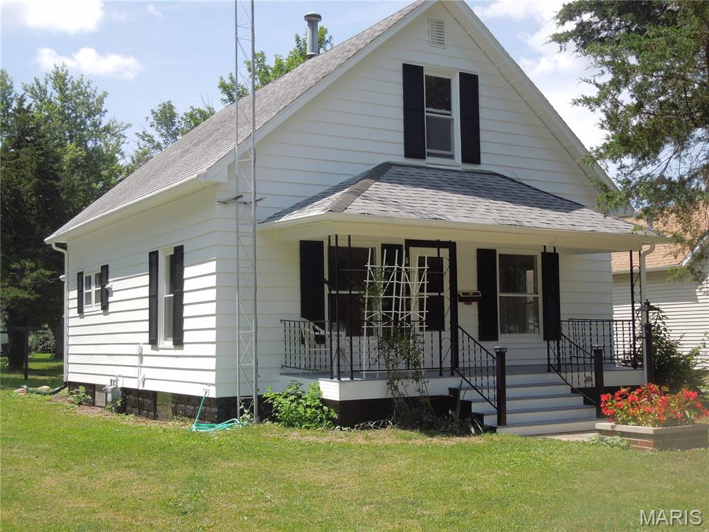 Must see this 1940's style home -totally renovated keeping some of the unique character!! Cute kitchen w/island-built-in oven -5 burner stovetop-pretty, glass backsplash-& so many cabinets!! Sep DR w/open staircase -Convenient 1/2 bath & main level bedroom ! Newer windows, full basement w/ washer & dryer & shower for those gardeners!! 1.5 car garage w/covered patio off side - Lg yard -enough room for ex garage - family cookouts!  Great front porch for relaxing & morning coffee!!