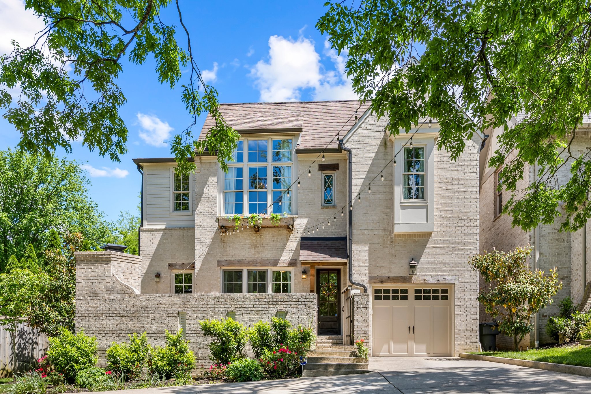 Beautiful, Tuscan inspired, unique design w/ bricked courtyard & masonry fireplace in a perfect location & setting... just minutes to hospitals, universities, Music Row, Green Hills & Belle Meade dining/shopping*like new, high ceilings, large picture windows offering plenty of natural light*not your typical layout, built by McKenzie Bldrs*primary suite with walk-in closet, spacious tile bath w/ separate tub/shower*crown mldg, hardwood, custom lighting, stainless appliances, built-ins & more!
