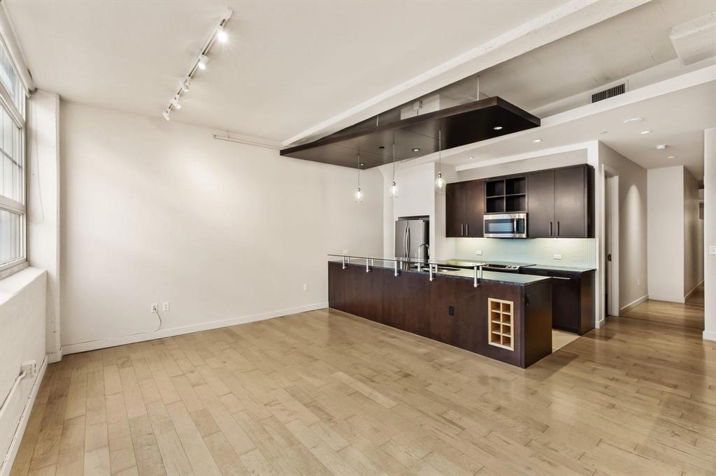 Welcome to Historic Montgomery Plaza! Enjoy effortless, lock-and-leave living in move-in-ready condo filled with natural light. This well-designed home features two spacious bedrooms with large closets, two full bathrooms, and an open living and kitchen area with granite countertops, stainless steel appliances, and generous storage, including a pantry and utility room. Large windows overlook the vibrant Montgomery Plaza shopping and dining district, while solid concrete construction provides a quiet, peaceful living environment. Residents enjoy outstanding amenities, including a 24-hour concierge, secure entry and package room, fitness center, movie theater, rooftop pool and spa, cabanas, fire pits, grilling areas, beautifully landscaped terrace, putting green, cornhole, and a dog park. Located just steps from restaurants, shopping, museums, nightlife, and the Trinity Trail, this home offers the best of Fort Worth living. The unit also includes two parking spaces in the secure garage, conveniently located near the elevator. Landlord will consider leaving the unit furnished for additional monthly fee.