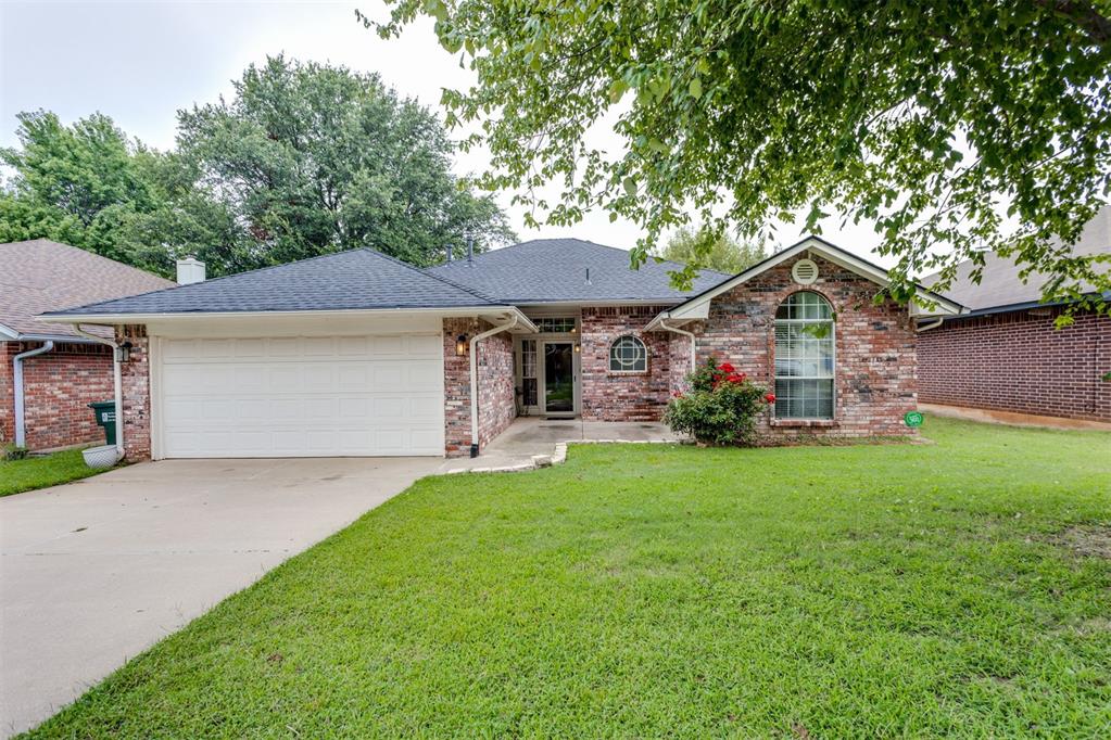 Updated charming brick home ~ front porch has a sitting area ~ home has updated wood type flooring throughout main home areas ~ living offers a corner fireplace ~ kitchen offers warm oak cabinets with granite countertops and stainless-steel appliances ~ nice sized primary bedroom .... primary bathroom offers a tub and shower and walkin closet ~ privacy fenced backyard with covered patio ~ newer roofing was installed in 2024... make your appointment to take a look at this one