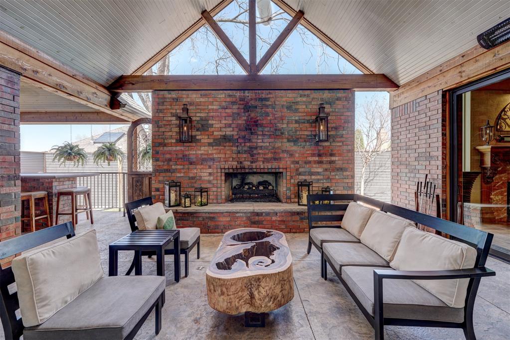 This impressive one story residence is built with sturdy 2" x 6" framed construction and extra insulation.  The spacious kitchen opens up to the breakfast area and vaulted living room making this a great space for entertaining.  The primary suite is private and roomy and equipped with a relaxing steam shower.  The second bedroom is on the front of the house and could also be a great home office.  Bedrooms three and four have a convenient joining bathroom with a tub/shower.  Step outside to the incredible outdoor living area that spans some 700 sq. ft. and features gas heaters, commercial misters , and a fireplace flanked by two cooper gas lanterns inspired by the Governors Mansion in New Orleans.  There is also large island dining area and a grilling station for the outdoor chef.  The low maintenance backyard turf area and putting green provides year round entertainment for both owners and guests.  The highly sought after three car garage has a large storage area accessed by a private staircase that could also be finished out as a gameroom or "man cave."