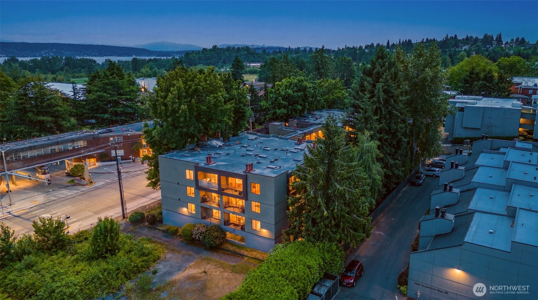 Rare opportunity to own one of the few units in the entire community with direct access to the expansive shared patio, offering a unique extension of your living space and an ideal setting for relaxing or entertaining.   The generously sized 719-square-foot, 1-bedroom, 1-bath condo features a well-designed floor plan with room for a full dining set, an in-unit washer and dryer, and abundant living space that feels both comfortable and functional. A secure garage parking stall and dedicated storage unit add everyday conveniences. Spacious and secure dog run for your furry companions.   With no rental cap, this home presents an exceptional opportunity for both homeowners and investors. Ideally situated in desirable Sand Point, you'll be just minutes from the University of Washington, University Village, Seattle Children's Hospital, the Burke-Gilman Trail, Magnuson Park and Beach, and all the shopping, dining, and recreation that makes this one of Seattle's most sought-after neighborhoods.   A rare combination of space, location, amenities, and investment potential.