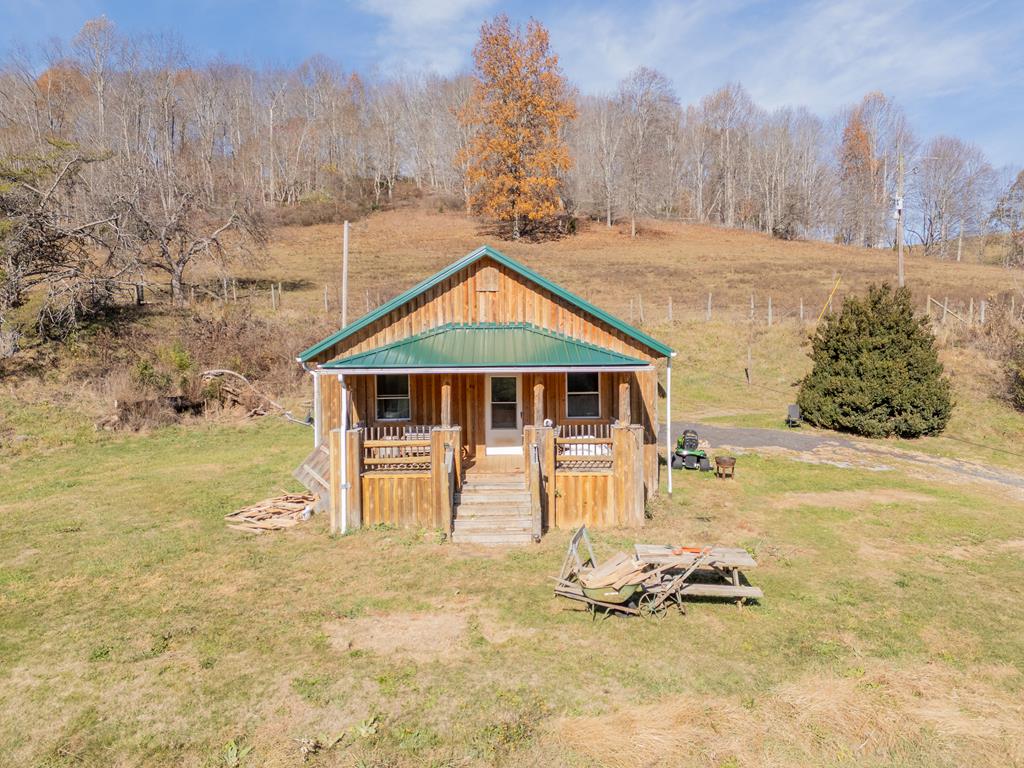 Looking for a tranquil retreat? This charming 2-bedroom 1 bath cabin on 12 acres of rolling pasture is the ultimate getaway! The multi-stall barn offers electric and water. Relax on your covered porch and enjoy the beautiful views! Don't let this opportunity slip away, book your showing!