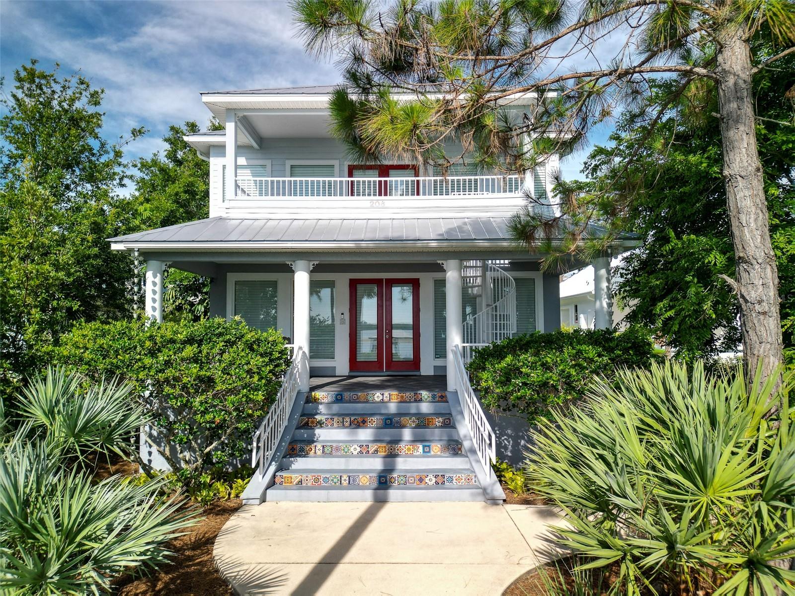 Intracoastal custom home with dock in great location just a short golf cart ride to town.  Large rooms, high ceilings and quality construction throughout.  There are covered riverfront porches on both levels and a private courtyard as well.  The great room has outstanding river views from the living room, dining room and kitchen featuring hickory cabinetry, large pantry, a moveable island and a spacious breakfast bar.  The primary suite has a private balcony, small office, large walk-in closet and bath and there’s a secondary en-suite located on the main level for those that want to avoid stairs.  The air conditioned workshop/storage area could be converted to additional guest space if needed.  The 200’ deep lot runs street to street with plenty of parking and rear access to a deep 2 car garage.  The dock was rebuilt in 2019 with flow-thru decking. Aluminum roofs and impact double pane windows throughout.  Low maintenance easy care yard needs no watering although there’s a well that’s been capped off and a sprinkler system no longer in use.  Natural gas heats the stove, water heater, dryer and the central heating, too.  The downstairs HVAC was replaced in 2024 and the water heater in 2023.  The home has central vacuum and is wired for a whole house generator. There’s an outside shower and the yard is fenced both front and back.  Great location close to two City parks with boat ramp and river beach.  Custom and quality construction built by M.R. Davis, this home has been used as a primary residence as well as a vacation/second home property and has been in the same family since built in 2007.  See to appreciate!