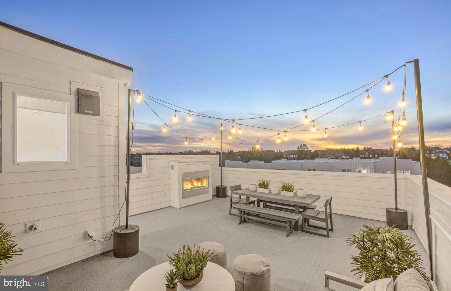 The 2-level Sydney is the Largest Condo at Belmont Overlook, offering the space of a single-family home where every space is thoughtfully considered. The home offers 3 Bedrooms, 2.5 Bathrooms, 1-Car Garage & 1 Car Driveway. The main level boasts an included covered terrace off the kitchen with an optional fireplace for entertaining or relaxing with your morning coffee. The main level has it all! A spacious kitchen offers a large island with a walk-in pantry.