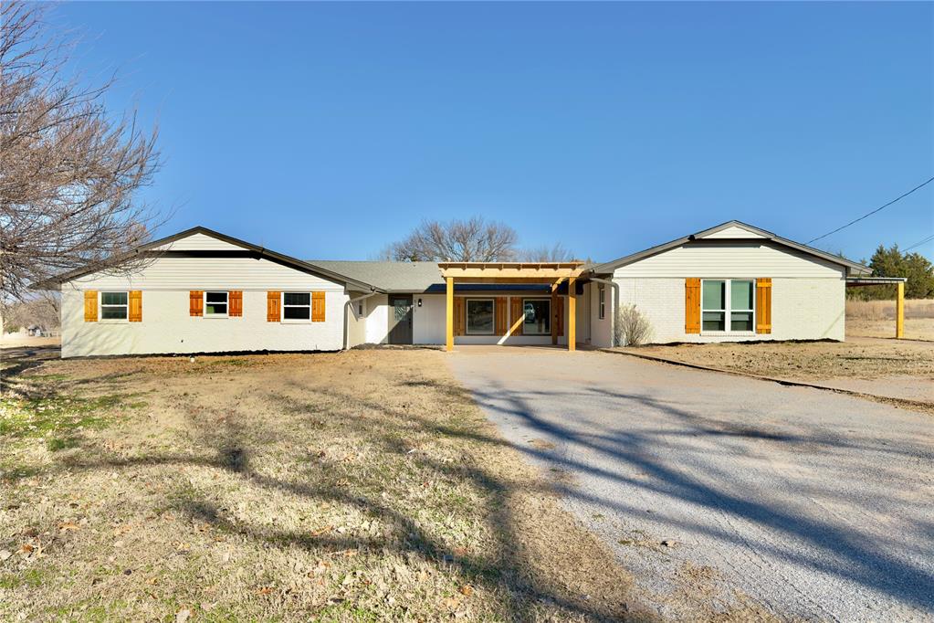 Not your typical Edmond home—and that’s exactly what makes it special.511 Highland Hills is a beautifully renovated, one-of-a-kind property built with real life in mind. Over 3,400 square feet of total living space, this home offers two fully self-sustained living units—making it an ideal setup for multigenerational living, extended family, or relationships that function best with a little space built in.The main residence offers over 2,000 sq ft, 3 beds, 2.5 baths, and warm, light-filled living areas. The living room stands out with a wood slat accent wall, while the primary suite feels like a true retreat—complete with a gas fireplace, a sunroom, and a spa-inspired bathroom with dark green tile, gold hardware, dual shower heads, and an oversized custom closet with built-ins. The half bath off the kitchen even includes a custom dog wash—because muddy paws happen.The secondary unit functions as its own private residence, offering 2 beds, 1 bath, a full kitchen, dining area, living room, laundry, separate electrical service, and its own HVAC. With separate exterior entrances, private patio space, and no interior connection, each space maintains its independence—close enough to be convenient, far enough to keep the peace. An in-ground storm shelter beneath the secondary bedroom adds peace of mind.The home sits on 3.36 acres in Logan Co., offering a more rural setting with lower county taxes, while still being zoned for Edmond schools. Outdoor features include a detached 2 car garage, a barn, and a seasonal pond that enhances the property’s natural character.Recent renovations include fresh paint inside and out, updated baths, new flooring, hardware, lighting, ceiling fans, and more—making this a move-in-ready home with flexibility built in.Homes like this don’t come along often. If you’ve been searching for space, versatility, and a layout that’s more than just “open and functional”—designed for the way people actually live—this one deserves a closer look.