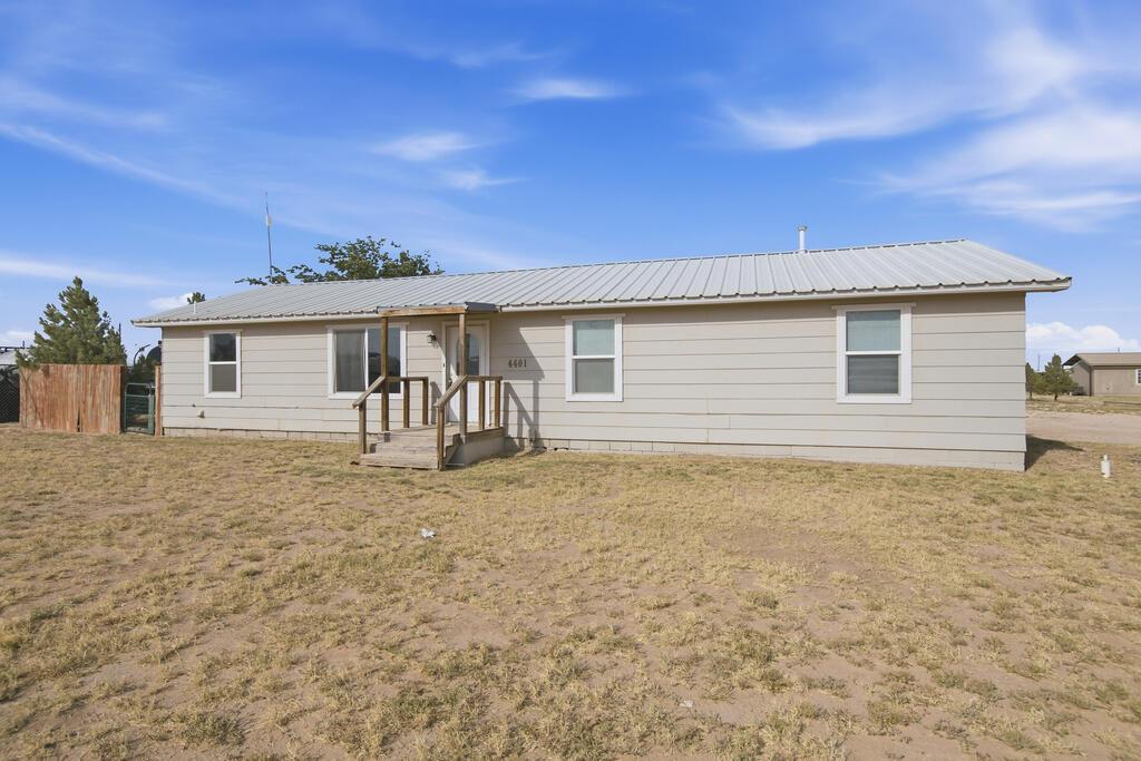 Single story home 3 bedroom , 2 baths with plenty of yard space. Open kitchen and living area. This home has a private  gated backyard. Other features  a covered car port and storage room for use  on the acre of land. Includes 5 onsite RV hookups