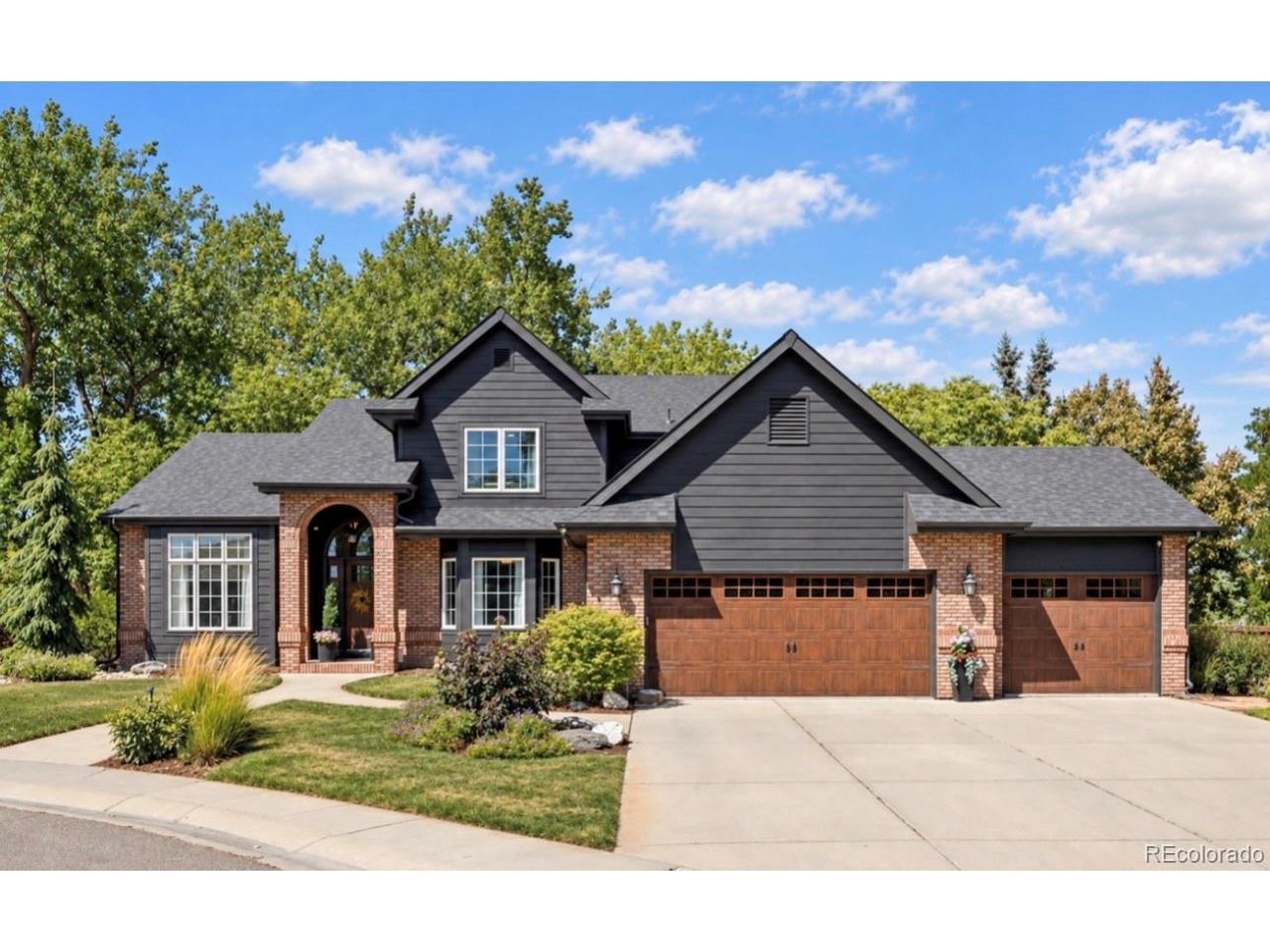 MAIN FLOOR PRIMARY, THREE CAR GARAGE & LAKE LOVELAND LOCATION!Prepare to say wow as soon as you pull up to 983 Logan Ct. The stunning study with glass door sets the tone, your first hint that this custom-built home has been remodeled and refreshed top to bottom. The updated kitchen is outfitted with all Viking appliances, and a large eat-in dining area. The main floor primary suite is a true retreat, with French doors opening to a private deck, and a fully remodeled primary bath. Upstairs, two generously sized bedrooms each have ensuite spa-like bath and built-in desks.The fully finished basement adds even more living space: a built-in coffee/wet bar and desk, another large bedroom with an ensuite custom-remodeled 3/4 bath, an office or 5th bedroom with a powder bath, and a rec room. A three car garage and fresh exterior paint round out a home that's completely turnkey.And the location? This home backs to green space and sits right across the street from Lake Loveland, with NO HOA & NO METRO. You're just a stone's throw from North Lake Park, tennis courts, and Benson Sculpture Park, and a short drive to historic Downtown Loveland for local restaurants, breweries, the Loveland Museum, and boutique shopping. With a location like this, and a home this thoughtfully remodeled, 983 Logan Ct. may just be the one you've been waiting for.
