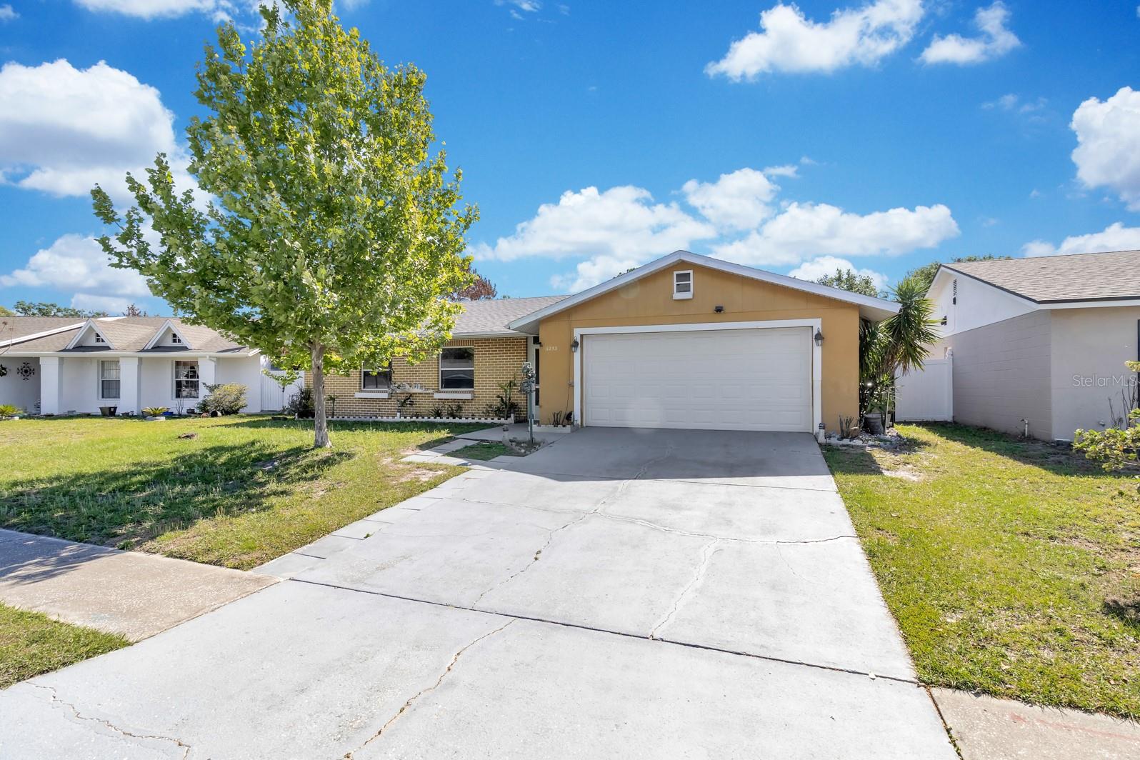 Welcome to this 3 bedrooms 2 baths home in the 32837. This home is bright with an open space. It has stainless steel appliances and Ceramic floors. The roof was replaced in 2024. This home has a 2 car garage with a door to the exterior side . The screened in back patio is large and it has a real wood fire place to enjoy with family and friends! this home also has a completed  workshop that can be use as extra storage and has a covered boat parking. Great school zoning and close to Disney, Universal Studios and SeaWorld. Dining restaurants and stores near by. Close to I-4, 417 and 528. Come to see it today!
