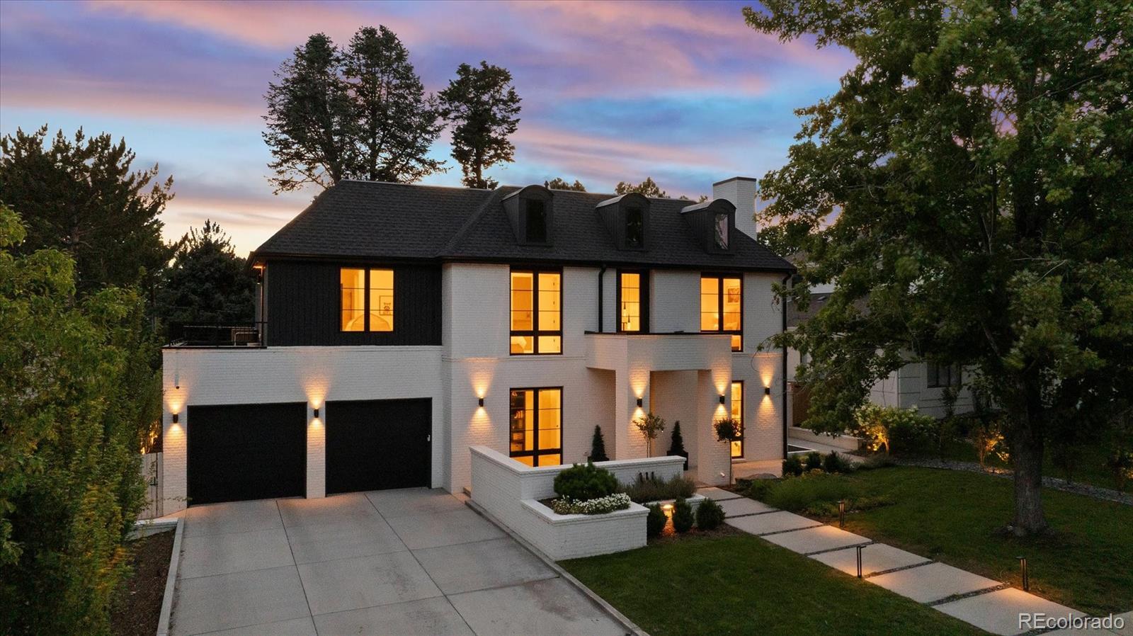 Modern Luxury in the Heart of Hilltop. Completed in 2023 and masterfully designed with timeless architecture and impeccable craftsmanship, this extraordinary Hilltop residence embodies the very best of Denver luxury living. Over the past three years, the home has been transformed into a private sanctuary through intentional design, exceptional landscaping, and carefully curated finishes. Every space has been thoughtfully crafted to balance sophisticated style with effortless comfort, creating a home that is as intelligent as it is beautiful. At the heart, a spectacular chef’s kitchen serves as both a culinary workspace and architectural centerpiece, anchored by a breathtaking Cristallo Quartzite slab, custom white oak cabinetry, and premium appliances. The floor plan flows seamlessly from one living space to the next, creating an ideal setting for both intimate gatherings and entertaining. Offering six generously proportioned bedrooms, highlighted by a tranquil primary retreat featuring dual walk-in closets and a luxurious spa-inspired bath. Upstairs bedrooms enjoy the privacy of en suites. Additional highlights include a private office, a fully finished lower level with two additional bedrooms, dedicated gym, expansive family room with fireplace and abundant space for the whole family. Designed to embrace Colorado’s four-season lifestyle, expansive walls of glass open to a backyard oasis. Mature trees, lush hydrangeas, vibrant wildflower gardens, fruit trees, and thoughtfully designed landscaping create a setting that feels worlds away from the city. A plunge pool transforms into a soothing hot tub, offering the perfect place to unwind on warm summer afternoons or beneath the falling snow. Located just moments from Cranmer Park, Graland and the shopping and dining of Cherry Creek, this nearly new custom residence presents a rare opportunity to own one of Denver’s finest modern homes. Refined, timeless, and exceptionally livable, this is luxury without compromise.