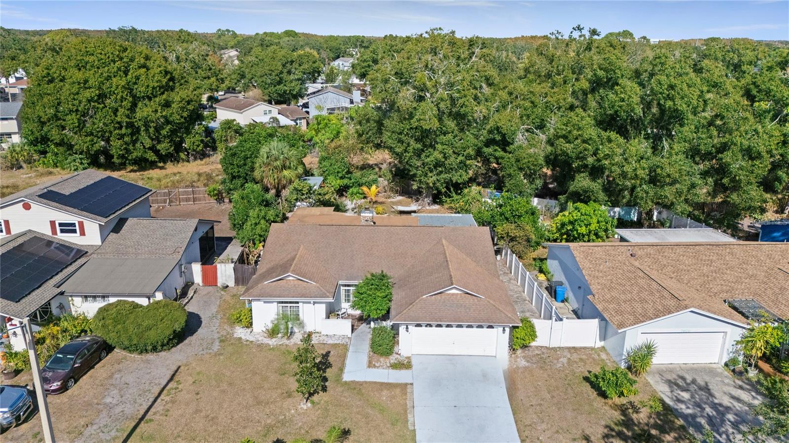 Stunning Modern Pool Home with Income-Producing In-Law Suite – No HOA!Welcome to this spacious and beautifully updated pool home that perfectly blends modern luxury with comfort and functionality. Featuring 4 bedrooms plus a fully permitted, renovated in-law suite, this property offers a total of 5 bedrooms and 4 bathrooms—ideal for multigenerational living or immediate rental income.Inside, you’ll find newly renovated bathrooms, updated flooring, and a stylish gourmet kitchen with brand-new granite countertops and modern appliances. The home also boasts a generous walk-in closet, a 3-year-old roof, and a whole-house upgraded water filtration system. A warm wood-burning fireplace adds the perfect finishing touch to the elegant living space.Step outside to your private pool oasis, complete with its own outdoor bathroom and outdoor shower—perfect for entertaining while keeping the interior spotless. For added convenience and modern living, all indoor bathroom mirrors feature Bluetooth speakers and defrost settings.The backyard includes a thriving garden with fruits and vegetables, offering both beauty and functionality. Enjoy the freedom of no HOA (only a $10 optional annual fee).Ideally located just minutes from downtown Tampa, Tampa International Airport, Clearwater, and St. Pete beaches, this home offers both luxury and unbeatable convenience.Buyer and buyer’s agent to verify all measurements and HOA information.This exceptional home won’t last long—schedule your private showing today!