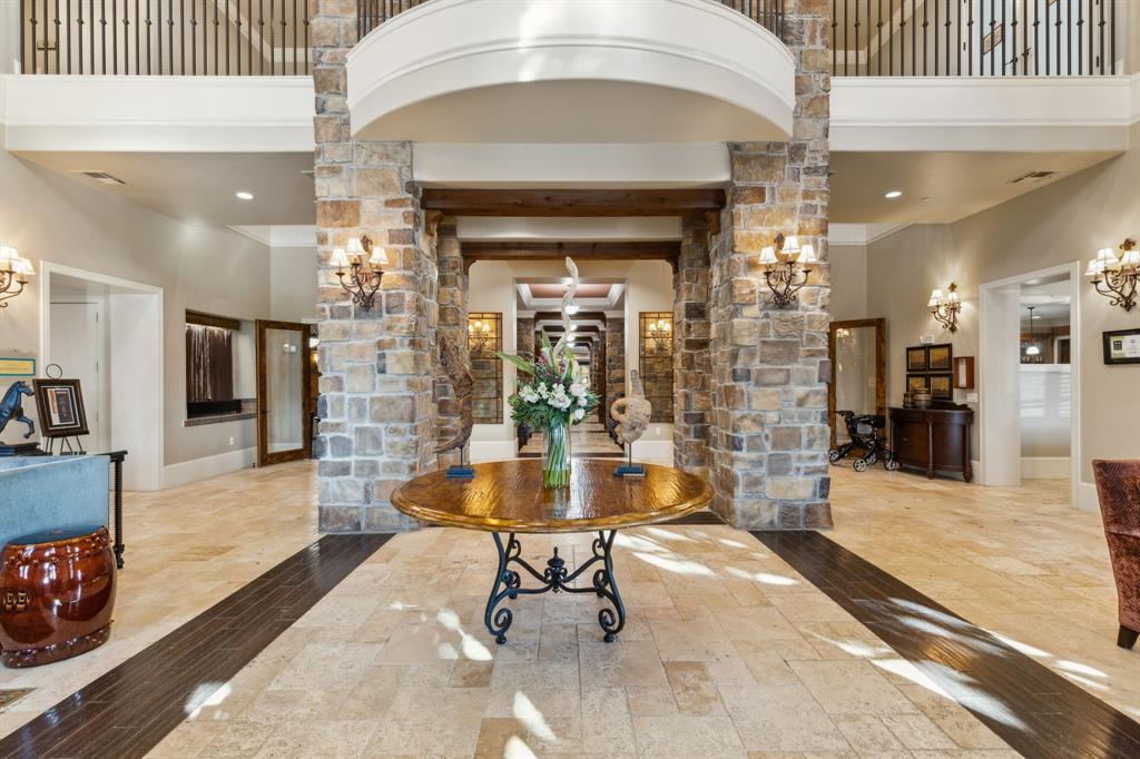 Experience luxury living in this exquisite top floor condo, offering amazing lake views. This beautiful one bedroom, one and a half bath unit features a kitchen with stainless steel appliances, granite countertops, and plenty of storage space, an elegant dining room upon entry, and an ensuite bedroom and spacious bathroom, with ample storage. The living room with a view is complete with built in shelves and plantation shutters. The utility room provides space for a full-sized washer and dryer. Step out onto the private balcony and take in the serene water views. Residents will enjoy an array of unparalleled amenities with the mandatory Club Membership included in the price of the condo. Membership provides access to concierge services, housekeeping, security, fitness programs, golf, water aerobics, full calendar of scheduled activities, dining at the café and restaurant, and lively cocktail hours. Always a full calendar of event at this luxurious senior living community. Condo has assigned parking in garage, spot 40.