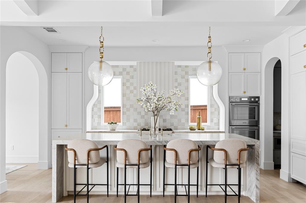 Designed by Jessica Koltun Home, this new construction in Lakewood embodies timeless elegance and modern sophistication. Spanning 5,041 square feet, the residence offers 6 bedrooms and 5 bathrooms, thoughtfully designed for elevated living and effortless flow.Inside, natural light accentuates refined materials, soft tones, and architectural detailing throughout. The open-concept design connects spacious living and dining areas to a chef’s kitchen appointed with custom cabinetry, professional-grade appliances, and a large island that serves as the heart of the home.The first floor features two bedrooms, including the primary suite, offering a serene retreat with vaulted ceilings, a spa-like bath, and a generous walk-in closet. Upstairs, additional en-suite bedrooms and flexible living spaces provide comfort and versatility for modern lifestyles.Every detail reflects the signature aesthetic of Jessica Koltun Home—a curated blend of warmth, sophistication, and enduring style—perfectly positioned in one of Lakewood’s most desirable settings.