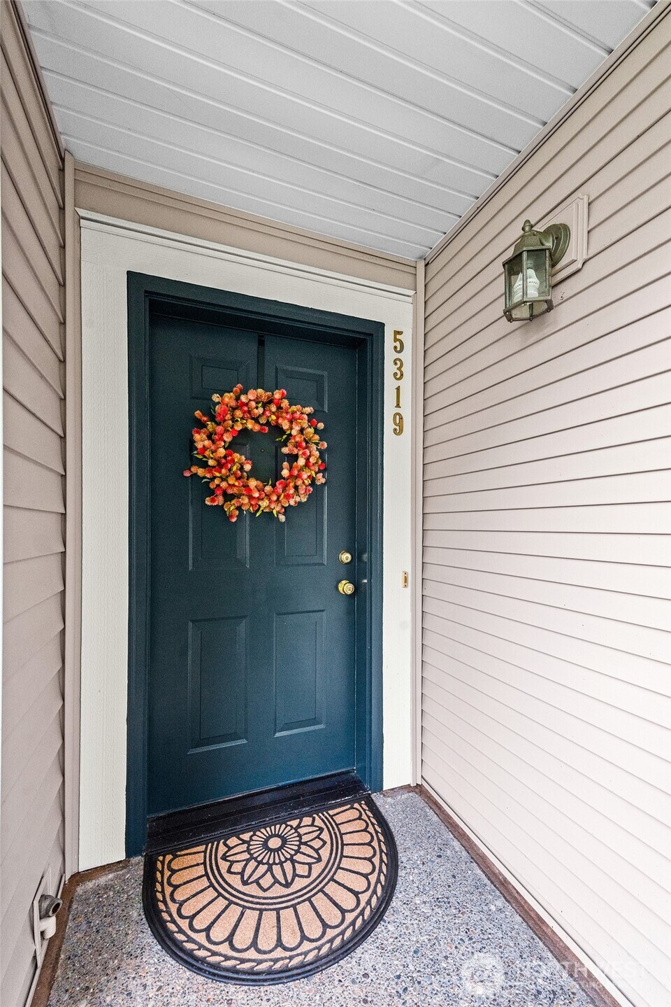 Stunning garden level end unit with covered patio, high ceilings, hardwoods, open dining & living room with wood burning fireplace. Professional remodel in 2024 includes kitchen and baths with quartz counters, ceramic tile floors, all new appliances including full size washer & dryer, carpet in both bedrooms. Spacious primary with walk-in closet, new tiled walk-in shower, floors. New wood slat blinds, new heaters, freshly painted throughout Garage parking plus extra parking in driveway. Guest parking, clubhouse w/gym, sauna & party room, walking & biking trails, beautiful water features & wildlife viewing. Wonderful community & location. Easy access to I5 N. & S. VETERANS can assume 5.75% 30 yr. fixed VA mortgage easily! A rare opportunity!