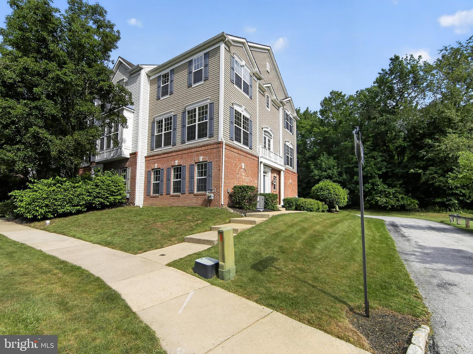 Welcome to your end-unit 3-bedroom 2.5-bath 3-story townhouse built in 2005 in the Windsor Ridge community, here in Chester Springs, PA. Enjoy the neighborhood amenities and ease of having the lawncare handled. Enter the ground floor through the sunbathed side entrance or the 2-car woods-facing garage to the foyer and relax in the bonus finished space off the laundry room. Head upstairs to the main-level featuring 9-foot ceilings, passing a powder room on the way, enjoy the naturally lit dining and living rooms or head to the eat-in kitchen with island and upgraded countertops to the left. Recharge in the upper-level bedrooms, the primary bedroom features a large walk-in closet, en-suite bath with tile floor, tub and walk-in shower. The hall bath is equipped with a tub shower, vinyl floor, and tile tub surround. Recent improvements include fresh wall paint, new carpet, new LVP foyer flooring in 2026, and new HVAC in 2025. Other features include newer appliances, hot water heater replaced in 2019, an active radon mitigation system with new fan in 2026 and owned water conditioning system. Feel like getting outside; the paved trails around the community are nearby, and several playgrounds are on route. Head to the park for basketball, soccer, tennis, and more. Hit the clubhouse for a swim, a workout, billiards, or host a party in the ballroom. 1825 Darlington Ln is in the Downingtown Area School District (East), Upper Uwchlan Township, and Chester County. This convenient location provides quick access by car to the PA Turnpike and Route 401 via Route 100, dining and shopping in the Village of Eagle, and Marsh Creek State Park. Come enjoy this home and make it your own!