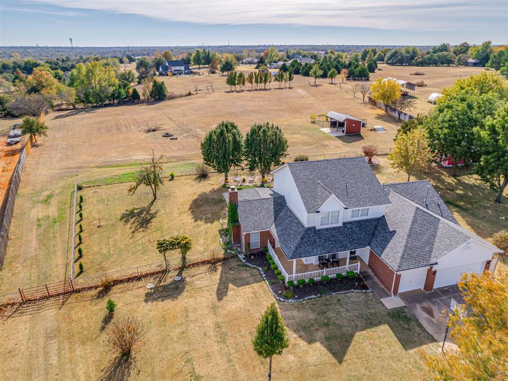 Country charm meets modern comfort on 3.44 acres (MOL) of peace and possibility!
Tucked just minutes from town, this warm and welcoming 4-bedroom, 3.5-bath farmhouse with a study offers everything you’ve been dreaming of—space, charm, and that true country feel without giving up convenience. Built by Calvin Vorderlandwehr, this home captures the look and spirit of a classic farmhouse with today’s updates and comfort built right in.
From the moment you arrive, you’ll fall in love with the large front porch perfect for coffee in the morning or relaxing after a long day. Step inside to find a bright, open layout with tons of natural light, stainless-steel appliances, a cozy flow between kitchen, dining, and living areas, and that comfortable, “come stay awhile” feeling throughout. The primary suite and half bath are downstairs, while three bedrooms (including a second ensuite) and two full baths upstairs offer plenty of space for family or guests. 
Outside is where this property truly shines— ready for your mini-farm dreams to come to life! There’s a two-stall open barn with water and additional storage building with 20-amp electric (added 2019) perfect for tack or working. Bring your horses, chickens, or even a pair of Highland cows—they’ll fit right in here.
Major updates you’ll appreciate:
• Roof & gutters replaced (2023)
• Heat & air units replaced (2021)
• Water softener replaced (2021)
• Drainage system installed (2021)
• Well pump & water heater replaced (2015)
• Barn concrete paved (2018)
• Exterior painted (2025)
A storm shelter adds extra peace of mind, and every inch of this home has been well cared for and thoughtfully improved.
If you’ve been waiting for a home that feels like country living done right—close to the city, but a world away in peace and charm—this is the one.
*Multiple offers received. Best and Highest due Sunday at 9am. Seller reserves the right to accept any offer at any time.