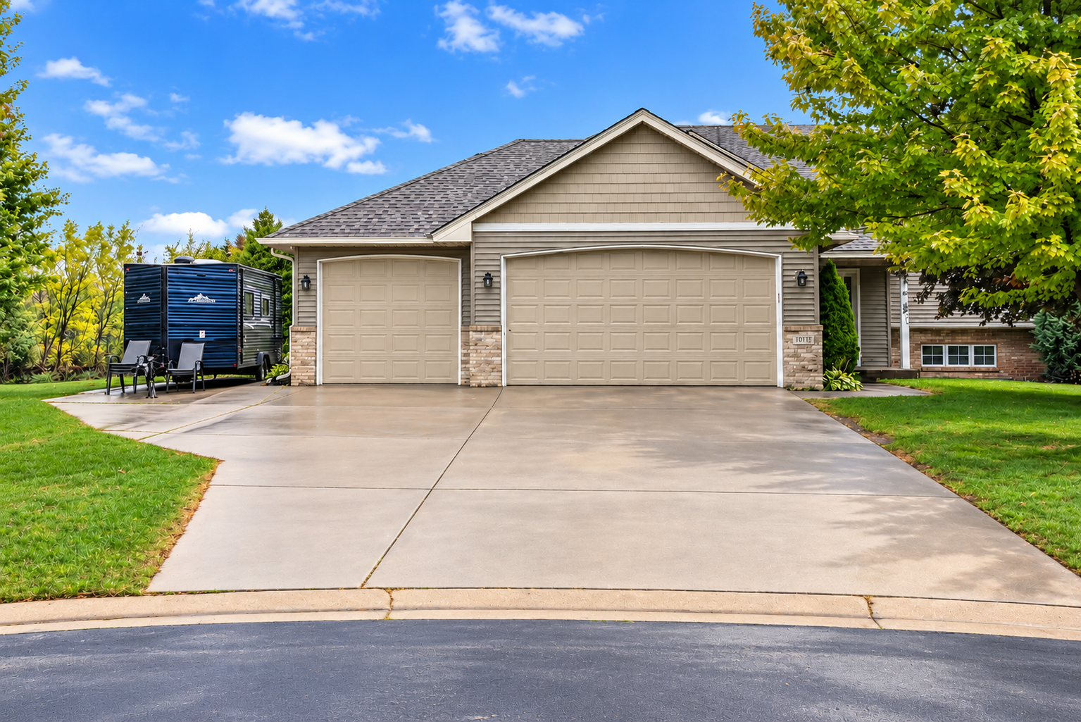 Cul-de-sac living with no neighbors directly behind! This spacious 4-level split features 4 bedrooms, 1 full and 1 ¾ bath with a walkout lower level. Enjoy a large family room with a cozy fireplace and bar area, plus a great backyard with added privacy. The concrete driveway offers extra parking alongside the garage. The impressive 3-stall garage is insulated, sheetrocked, heated, and 25 feet deep—perfect for vehicles, toys, storage, or a workshop! New Roof and siding July 2022