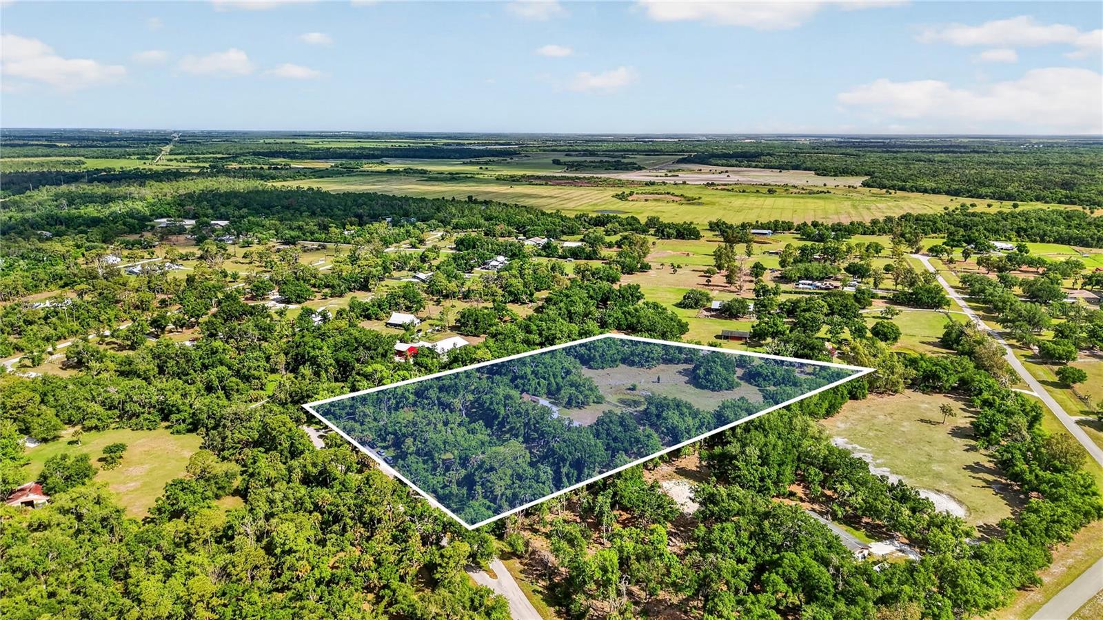 Located in the highly sought-after Myakka Valley Ranches, this 5.74-acre property offers privacy, space, and endless potential surrounded by majestic oak trees and natural Florida beauty. Situated at one of the highest elevations in the valley, this property is located in Flood Zone X and has never flooded, offering added peace of mind. A scenic pond on the property adds to the charm and creates a peaceful setting to enjoy the outdoors.This 3-bedroom, 2.5-bathroom home features 1,790 sq.ft. of living space, a pool, hardie board siding and a 2-car garage, providing a solid foundation for someone ready to update and make it their own. There is also additional space above the garage with the potential to be converted into a 4th bedroom, offering even more flexibility and value. While the home does need TLC, two major improvements have already been completed with a 2021 roof and a 2019 A/C, giving buyers a great head start as they create their ideal country retreat.Enjoy peaceful acreage living with plenty of room for horses, barns, gardens, or additional structures, all while being conveniently located near A+ rated schools, shopping, and dining. Myakka Valley Ranches is known for its large homesites, private roads, and quiet rural feel, yet you're still approximately 30 minutes to world-famous Siesta Key Beach and a short drive to Downtown Sarasota.Whether you're looking for a renovation project, investment opportunity, or a chance to build equity in a desirable acreage community, this oak-filled, high-and-dry property offers incredible potential in a prime Sarasota location. Priced to sell quickly—schedule your tour today!