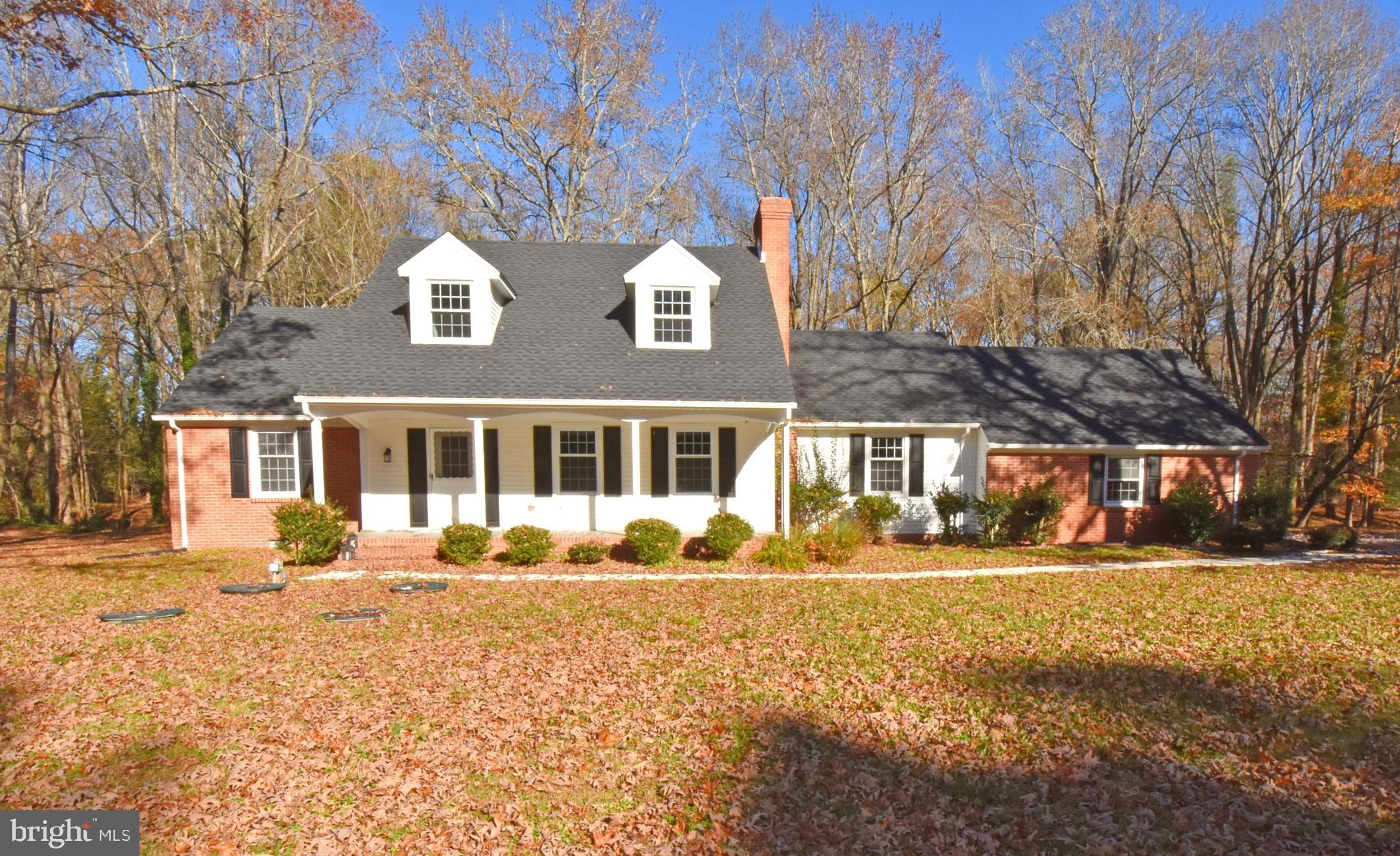 Discover the perfect blend of classic charm and modern comfort at 4011 Grosse Point Dr, a stunning 4-bedroom, 2.5-bathroom Cape Cod–style home offering 2,500 sq ft of beautifully redesigned living space. Completely remodeled in 2024, this home thoughtfully preserves its original character while showcasing high-end updates throughout. Step inside to find wainscoting throughout the main level, adding warmth and timeless appeal. The inviting living area features a double-sided brick fireplace, creating a cozy focal point for both relaxation and entertaining. The entry-level master suite provides convenience and luxury, boasting an updated bathroom with a custom walk-in shower. Upstairs, a versatile bonus room offers endless possibilities—perfect for a playroom, office, studio, or additional bedroom. This home has been refreshed from top to bottom with major upgrades, including a new septic system, new HVAC, new roof, recessed lighting, updated fixtures, new granite countertops, new kitchen appliances (refrigerator, oven/stove and microwave) new flooring, and fresh paint throughout. Every detail has been considered to provide peace of mind and move-in-ready comfort. Full of character and modern touches, this Cape Cod gem is ready to welcome its next owner. Don’t miss your chance to make it yours!