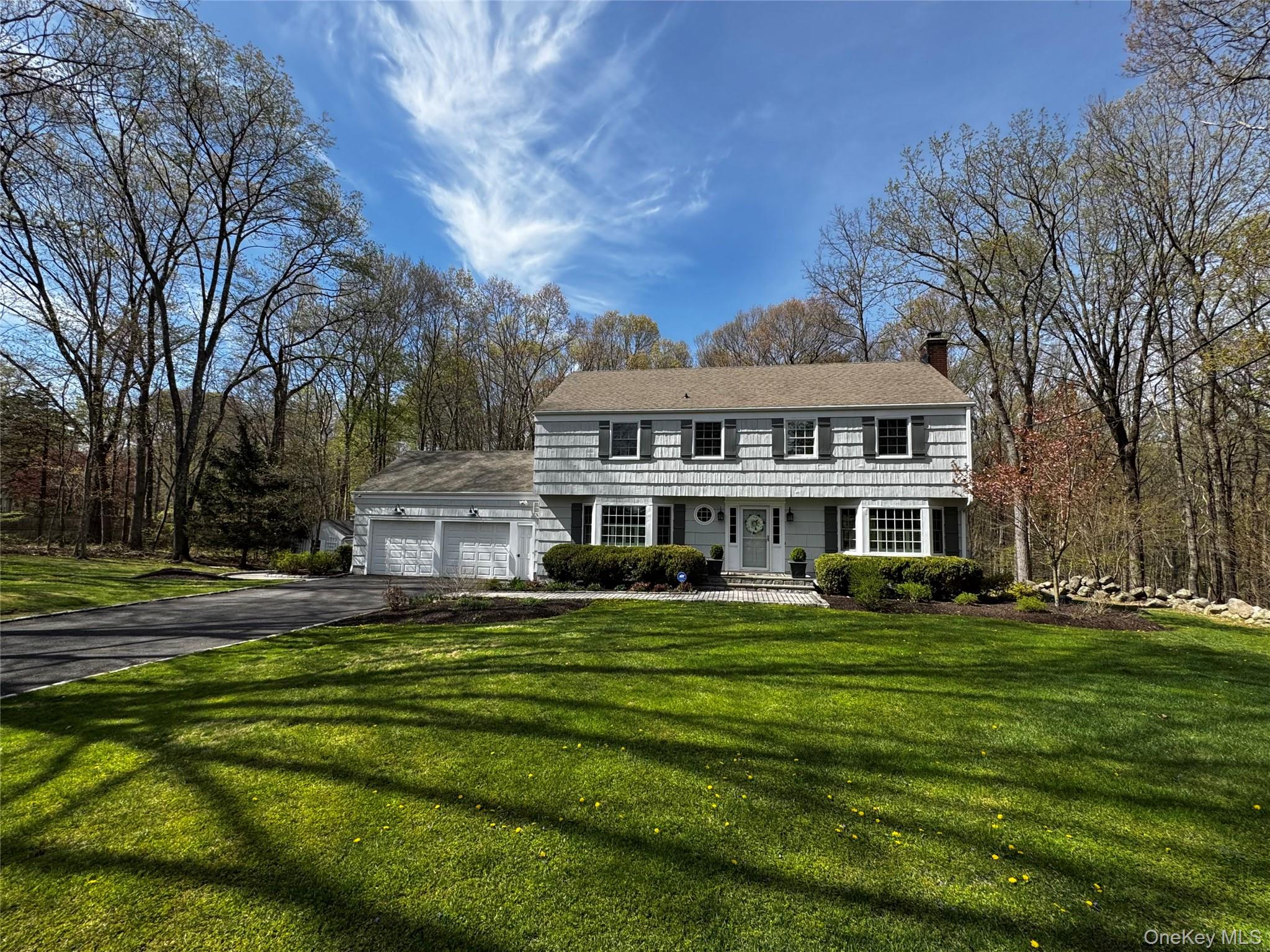 COUNTRY PERFECTIONThoughtfully sited upon over two beautifully landscaped acres against a scenic wooded backdrop, this meticulously maintained, updated five-bedroom classic colonial offers the perfect combination of peace, privacy, convenience, nature, and award-winning Katonah-Lewisboro schools in a quiet country setting.Move right in with nothing to do but plan your summer garden of flowers, fruit, vegetables… add a chicken coop for fun and fresh eggs… create a play space/cornhole/badminton/bocce/picnic area… the expansive fully-fenced garden framed by wisteria, lilacs and more is full of possibilities and the centerpiece of the back of the property.A welcoming entry foyer opens to sun-filled, beautifully appointed rooms scaled for relaxing daily life and entertaining relatives and friends, with a well-appointed kitchen, spacious dining room, living room with fireplace, and family room.  A fabulous three-season room with walls of windows and door to large deck brings nature in, with surrounding views of the gardens and woodlands.The second floor features a primary en-suite bedroom with a walk-in closet and updated full bath, three additional bedrooms, updated full hall bath, and attic storage.The finished walk-out lower level with game and movie room provides additional space for entertaining, and a fifth bedroom with updated full bath — perfect for a home office, private guest/in-law/nanny suite, with a door out leading to the back lawn and garden.A spacious 2-car garage and charming potting shed provide ample storage for recreation and gardening supplies!Perennials and specimen plantings abound on the property, including flowering trees and shrubs such as lilac, wisteria, ornamental cherry, hydrangea, spirea, dogwood, in addition to evergreens and perennial beds, all providing color throughout the seasons.The second floor has central air conditioning, and the main and lower levels wall units.  A transfer switch for the new generator provides electricity to the essentials in the event of a power outage.Enjoy the country life with today’s amenities, located at the end of a quiet cul-de-sac within the Katonah-Lewisboro School System, minutes from Oakridge Commons Shopping Plaza as well as the towns of Ridgefield and New Canaan, convenient to a vast array of shops, restaurants, museums, theatre, parks/preserves, and a multitude of recreational opportunities.