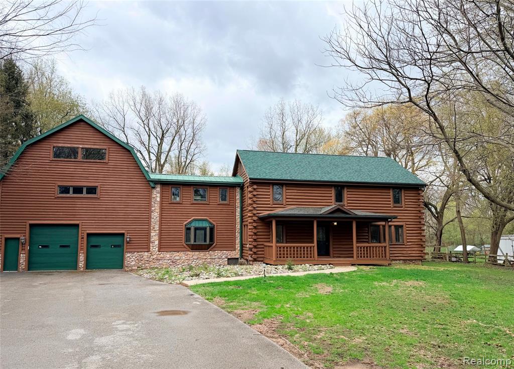 Rare Opportunity Featuring a True Private In-Law Suite on 1.89 AcresBeautiful log cabin–style home with a modern, refined feel, thoughtfully updated while preserving its natural warmth and character. Natural wood walls and trim are paired with contemporary finishes throughout, creating a unique blend of rustic charm and modern comfort.Outdoor living is a standout feature with a massive approx. 2,200 sq ft deck—an entertainer’s dream, perfect for relaxing or hosting gatherings in this private nature retreat surrounded by woods and a scenic creek.Inside, the home boasts custom cabinetry throughout most areas, with granite countertops in the fully rehabbed primary kitchen and quartz countertops in additional kitchens and living spaces. Durable LVP flooring complements a cohesive palette of Sherwin-Williams Accessible Beige, Alabaster cabinetry, and accents of Evergreen Fog and Sea Salt, finished with matte black and oil-rubbed bronze hardware.Offering 4,676 sq ft of living space, the home includes a private secondary living area with its own kitchen, full bath, laundry, and separate entrance—ideal for extended family, multigenerational living, or potential rental income. Additional space includes a basement of approximately 2,000 sq ft, clean and well-lit, perfect for storage, recreation, or future finishing.A 4-car garage with doors on both sides adds flexibility and convenience. Situated on 1.89 acres with approx. 120 feet of road frontage, the property is located within Bedford Schools and is close to shopping, dining, and commuter routes.Major updates include two high-efficiency furnaces, new A/C, electrical updates, a new sump pump, and all new appliances in the main kitchen. A one-year home warranty is included for added peace of mind.