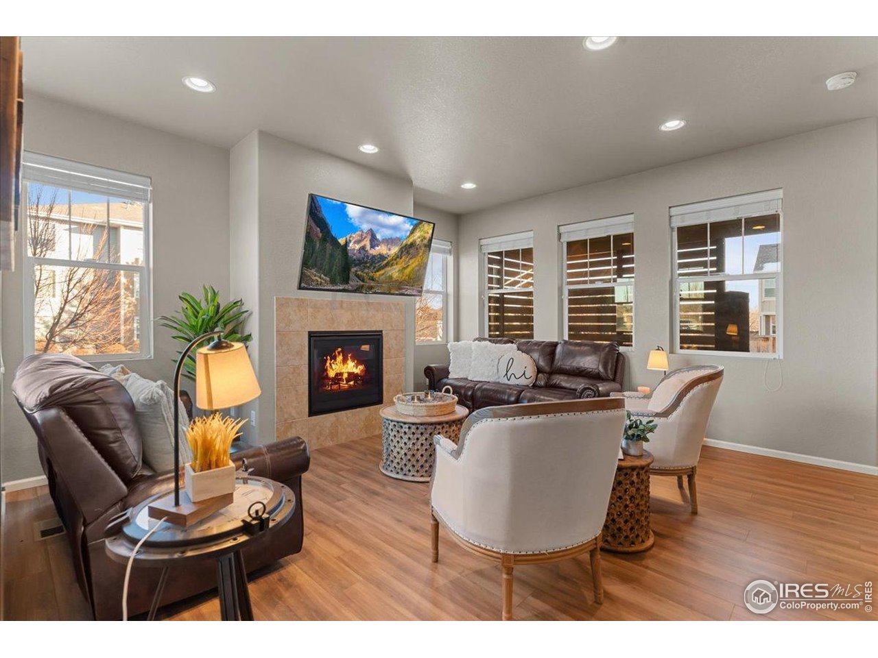 This beautifully designed 4-bedroom, 4-bath home is in wonderful, almost-new condition and offers comfort, space, and modern style throughout. The open floor plan features a large kitchen with granite countertops, tons of cabinetry, and generous prep space, flowing into the living room with a cozy gas fireplace. The main level showcases LVP flooring and a welcoming covered front entry. Enjoy a fully fenced backyard and private enclosed back patio. Upstairs includes three bedrooms, a versatile loft, and a spacious primary suite with a 5-piece bath, vaulted ceilings, and walk-in closet. A 2-car garage adds convenience while situated nicely on a corner lot. Ideally centrally located near grocery stores, coffee shops, and biking trails. Truly a move-in ready home!