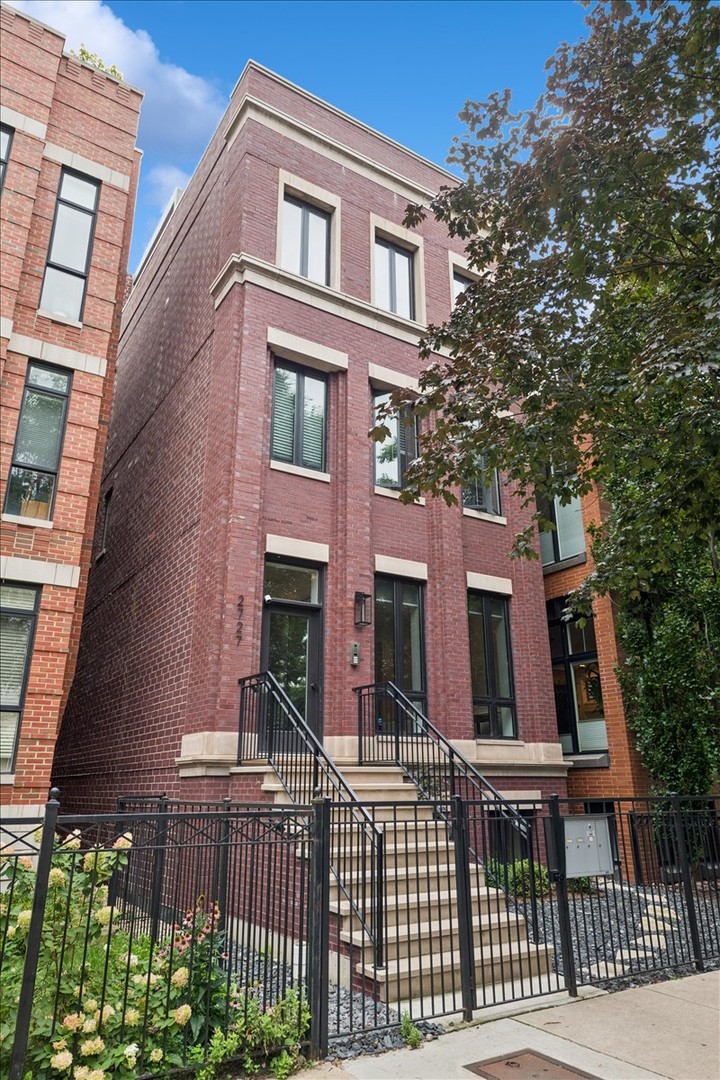 On a quiet, tree-lined street in Lincoln Park, a home awaits that feels both timeless and brand new. Built in 2022 on an extra-long lot, this 2,800-square-foot duplex down lives like a single-family home-designed for connection, comfort, and the rhythms of everyday life. With 4 bedrooms and 3.5 baths across two spacious levels, it's more than just beautiful; it's better than new construction, move-in ready with every thoughtful upgrade already done for you.    The first floor unfolds as a story of light and gathering. A gourmet kitchen, dressed in custom white cabinetry, quartz countertops, and a classic subway tile backsplash, sets the stage for meals that turn into memories. A professional Thermador suite, oversized waterfall island, and butler's pantry with beverage fridge make every moment effortless, while a walk-in pantry keeps life neatly tucked away. The kitchen flows into dining and family rooms where custom blinds frame sunlit windows, and a built-in desk with dual bookcases adds charm and function.    From here, the home extends outdoors to a covered patio designed as a true three-season retreat. Built-in heaters and a ceiling fan stretch its use through spring, summer, and fall. Custom exterior blinds filter light and privacy, while a flat-screen TV and gas-powered fireplace transform the space into an outdoor living room. There's room for dining, lounging, and lingering-and an additional grade-level patio only adds to the possibilities.    Downstairs, the lower level becomes a place of rest. All four bedrooms are thoughtfully tucked away, creating quiet sanctuaries. The primary suite is its own retreat, with two large walk-in closets and a spa-like bath where quartz finishes, dual vanities, a freestanding soaking tub, a steam shower with multiple heads, and a private water closet turn daily routine into ritual. Three additional bedrooms and beautifully appointed baths offer comfort and flexibility for family, guests, or a home office.    With garage parking included and every detail already complete, this home is as practical as it is elegant. And beyond its walls, the best of the city is just steps away-parks, shops, cafes, DePaul, and the train that carries you anywhere your day leads.    Here, in the heart of Lincoln Park, you'll find more than a home. You'll find a story waiting to unfold-one of ease, connection, and a life beautifully lived.