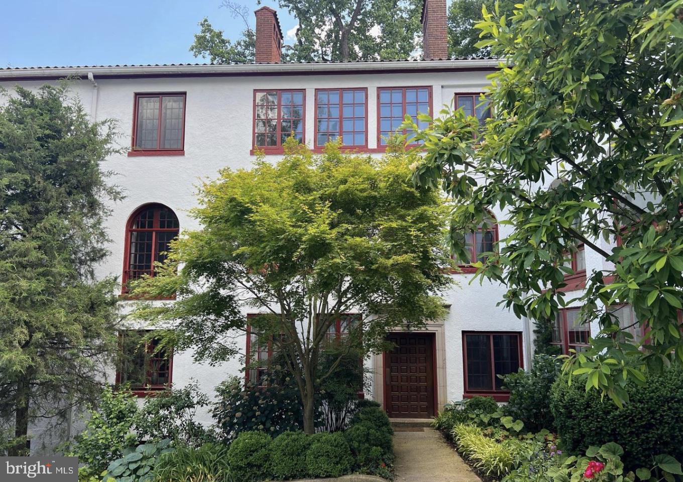 Offer deadline Wednesday, 9/9 at 5 PM.  Welcome to The Gardens of Guilford, a hidden gem that evokes the charm of a quaint Mediterranean village. Built in 1922 by the renowned architect Clyde N. Friz, this remarkable enclave beautifully marries Mediterranean and Italian Renaissance architecture, allowing you to experience a delightful stroll through history. Step into this spacious first-floor unit, where your dream living experience awaits. As you enter through just one single step, you are greeted by a warm and inviting entrance hall that hints at the delightful spaces to come. To your right, discover a generous living room featuring a cozy wood-burning fireplace and elegant built-in shelving—perfect for showcasing your favorite books or cherished decor pieces. French doors gracefully open to reveal an enchanting sunroom, bathed in light and framed by stunning windows that invite the outdoors in.The property boasts a primary bedroom complete with its own en-suite bathroom, alongside two additional bedrooms and a full hall bathroom, making it ideal for family living or hosting guests. For those who love to entertain, the expansive formal dining room provides ample space for gathering with friends and family.Culinary enthusiasts will rejoice in the sunlit kitchen, designed with functionality in mind. With an abundance of counter space, generous storage, and the convenience of an included washer and dryer, this kitchen is truly a culinary haven. Perhaps the best part of this property is the exceptional rear deck and the expansive bricked hidden courtyard. This extraordinary outdoor space redefines al-fresco living—whether you're dining under the stars, enjoying a refreshing drink, or basking in the sun, it’s a gardener’s paradise with its desirable Southwest exposure.Additionally, the unit includes a lower-level storage room for your convenience, as well as one deeded garage and an extra deeded storage garage. Don’t miss the opportunity to claim your own slice of paradise in this picturesque setting!
