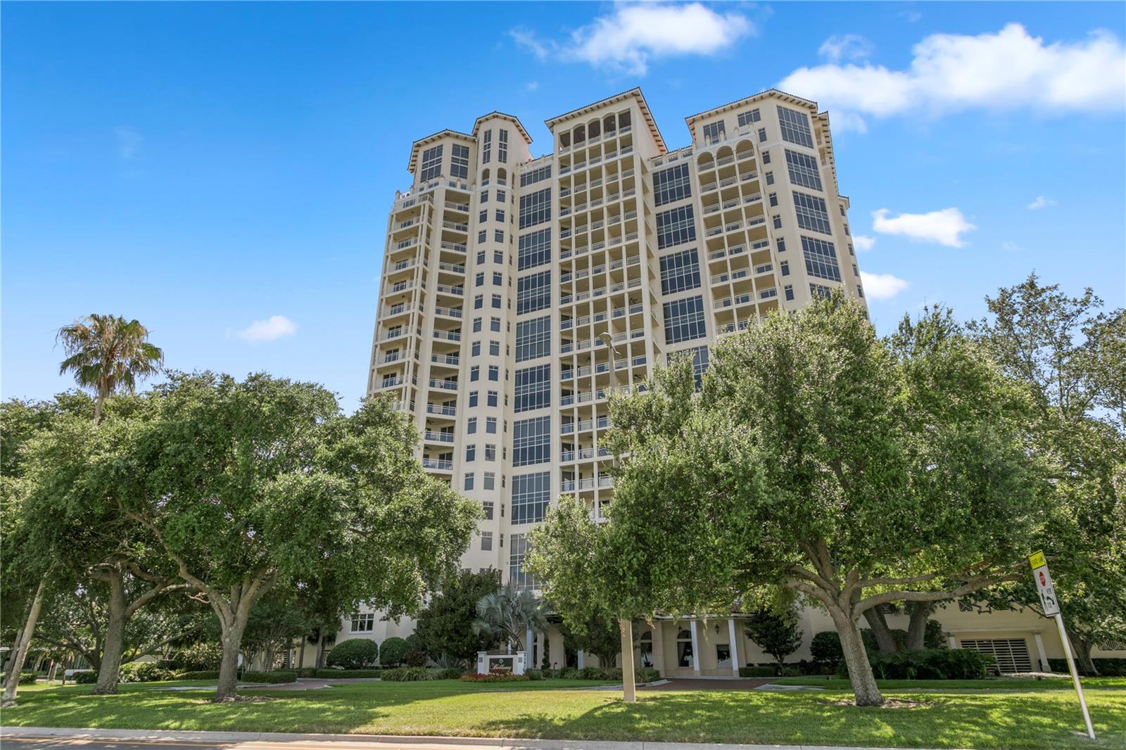 Experience elevated luxury living in this rarely available 10th floor residence at The Bellamy, one of Tampa's most desirable addresses. Offering over 3,300 square feet of refined living space, this home showcases panoramic views of Hillsborough Bay, Bayshore Boulevard, and the downtown skyline from nearly every room. A private elevator opens to an elegant foyer leading to open living and dining areas framed by floor-to-ceiling windows that fill the home with natural light. The gourmet kitchen overlooks the bay and features custom cabinetry, Thermador appliances, quartz countertops, and a large center island, creating a perfect space for entertaining while enjoying the view. The primary suite is a tranquil retreat with two walk-in closets, a private balcony, and sweeping water views. The spa-inspired bath includes a large walk-in shower, dual vanities and designer finishes. Two en-suite guest bedrooms offer comfort and privacy, while the dedicated office with custom built-ins provides an inspiring workspace surround by city views. Newly installed hurricane shutters on all sliders add convenience and protection. Residents enjoy resort-style amenities, including a 24/7 concierge, beautiful lobby, wine room, library, two social rooms, fitness center, conference room, outdoor gardens, pool and spa, BBQ area, and private theatre. The building also offers two guest suites for visitors. This residence includes two parking spaces with an EV charger and a storage unit. Perfectly positioned just minutes to Hyde Park, Downtown Tampa and Tampa International Airport, this exceptional unit offers unmatched views and the best of resort-style living.