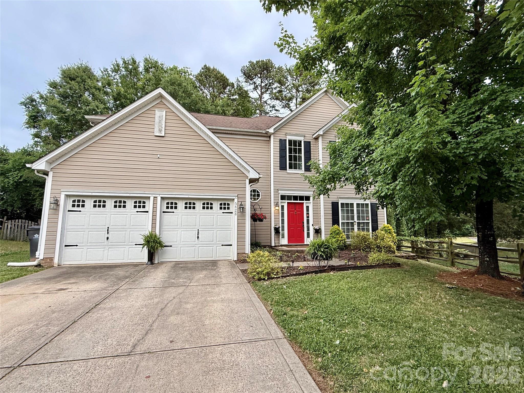 Tucked away on a long cul-de-sac street in the highly desirable Highland Creek community, 6428 Tunston Lane offers the perfect blend of comfort, privacy, and convenience in one of the Charlotte area’s most sought-after neighborhoods. This beautifully maintained 3-bedroom, 2.5-bath home features approximately 1,926 square feet with an inviting layout designed for both everyday living and entertaining.From the moment you step inside, you’ll appreciate the warmth of the prefinished hardwood floors and the natural flow of the home. The spacious family room opens seamlessly into the breakfast area and kitchen, creating an ideal gathering space for family and friends. The kitchen is equipped with stainless steel appliances, abundant cabinet space, and easy access to both the dining room and backyard patio, making entertaining effortless.The main level also features a versatile living room/den/flex space that can easily function as a home office, playroom, media room, or additional sitting area depending on your lifestyle needs. Upstairs, the spacious primary suite offers a relaxing retreat complete with a private bath and generous closet space. Two additional bedrooms and another full bath provide plenty of room for family, guests, or hobbies. The upstairs laundry area adds everyday convenience to the thoughtfully designed floor plan.Step outside and discover your own private backyard oasis. The fenced rear yard is surrounded by mature trees that provide privacy and a peaceful setting rarely found at this price point. Enjoy evenings around the fire pit, morning coffee on the patio, or relaxing walks to the nearby pond with fountain that adds to the neighborhood charm and tranquility.Living in Highland Creek means access to an unmatched lifestyle with resort-style amenities including pools, tennis courts, playgrounds, walking trails, fitness facilities, golf, and a vibrant community atmosphere. Residents love the convenience of being just minutes from Concord Mills Mall, abundant shopping, popular restaurants, entertainment venues, and area attractions including NASCAR events and major sporting destinations. Quick access to I-485 and I-85 makes commuting to Uptown Charlotte, Charlotte Douglas International Airport, and surrounding areas incredibly convenient.Whether you’re searching for neighborhood amenities, outdoor enjoyment, or a location close to everything Charlotte has to offer, 6428 Tunston Lane delivers the ideal combination of lifestyle, comfort, and convenience in the heart of Highland Creek.