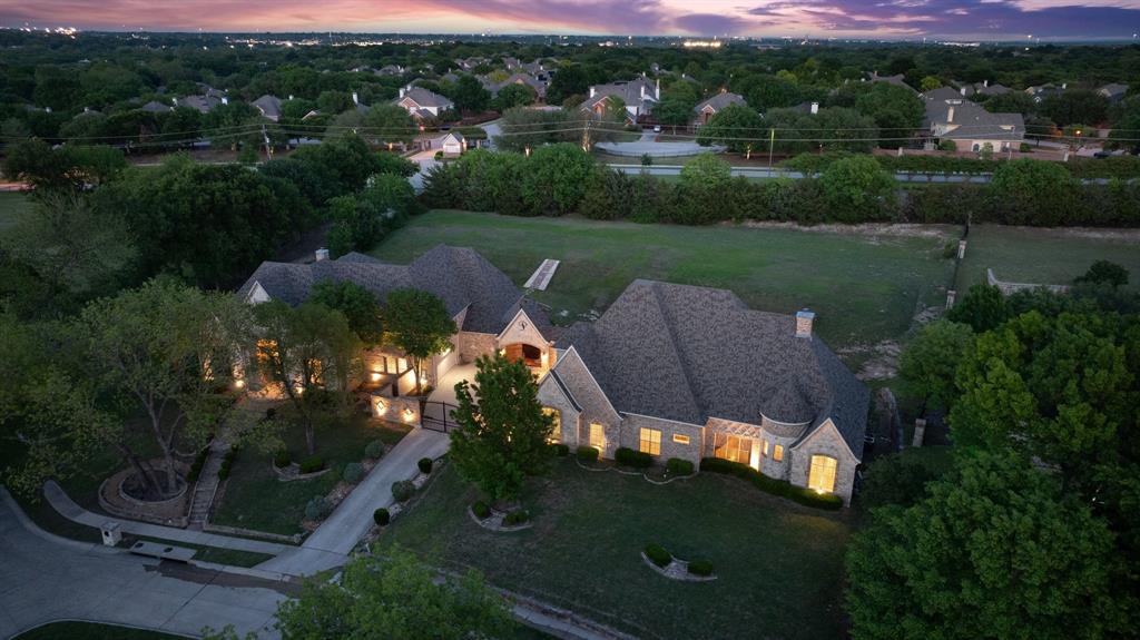 Located in the prestigious Chancellor Creek, this extraordinary estate offers a rare blend of scale, privacy, and resort-style living on nearly 1.5 acres. Just minutes from Stonebridge Ranch Country Club, the property delivers an unmatched lifestyle in one of McKinney’s most sought-after communities.Designed for both grand entertaining and everyday comfort, the main residence spans with expansive living areas, soaring ceilings, and refined finishes throughout. The chef’s kitchen is equipped for elevated hosting, seamlessly connecting to multiple gathering spaces, a media room, and a custom bar area that invites unforgettable evenings at home. A standout feature of the property is the fully equipped guest residence, offering two full size bedrooms each with a private bathroom, private balcony overlooking the backyard, large upstairs mixed use living area, and its own kitchen and living quarters—ideal for multigenerational living, long-term guests, or income-producing opportunities.The primary suite serves as a true retreat, offering generous space and privacy, while additional bedrooms provide flexibility for family, guests, or work-from-home needs. Step outside to your own private resort—complete with a pool and spa, covered outdoor living area, and a sprawling backyard with endless possibilities for recreation and entertaining.Car enthusiasts and entertainers alike will appreciate the expansive 6-car garage, with 10 ft clearance for large vehicles, circular drive, and additional space designed for convenience and function. Zoned to highly acclaimed McKinney Independent School District, this one-of-a-kind estate delivers luxury, versatility, and privacy—all in a prime location.