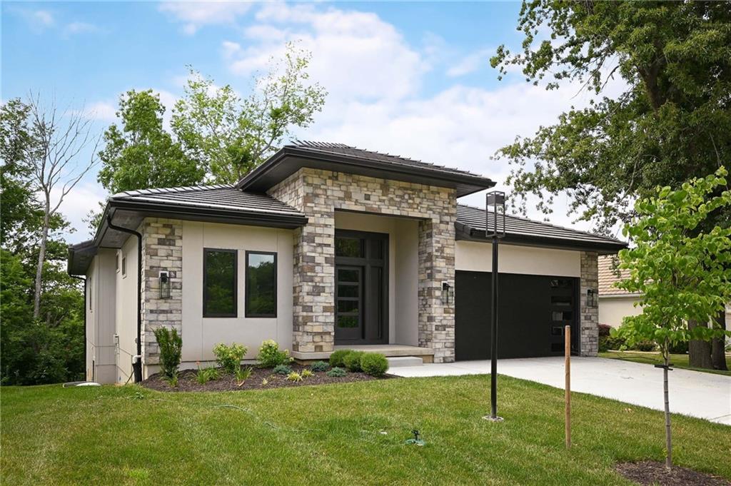 Custom Home now complete and ready for Move-in! Opportunity Knocks for NEW Build Construction with Walker Custom Homes in the newly expanded community of Lake Winnebago.  Modern Reverse Story Home with Tile Roof backing to trees with short walk to Lake. Enjoy this maintenance provided area with build by Walker Custom Homes which is one of the premiere builders who has built many custom homes at Lake Winnebago.  Here is your chance to enjoy all that Lake Winnebago has to offer with a newly expanded lake, skiing/wakeboard options, yacht club dining , sailing, or just chance to enjoy the views! (maintenance fee is $250/mo & includes lawn mowing, edging, seasonal treatments, irrigation/sprinklers, common area with gazebos and dock slips, and one free pontoon for use by sign up)