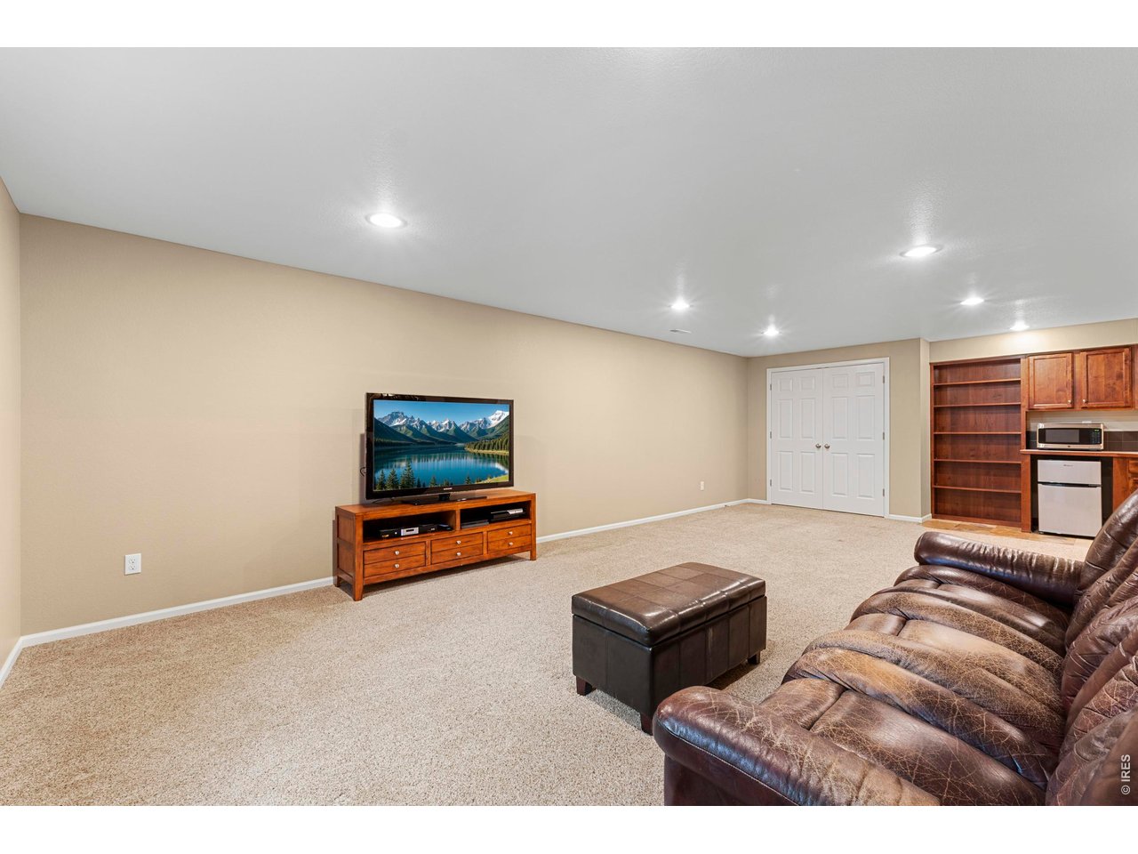 Welcome home to comfort, connection, and effortless living in the desirable Stetson Creek neighborhood. Step in from the covered front porch and you're immediately greeted by warm tones, rich hickory floors and an attractive, functional open floor plan designed with both everyday living and gathering in mind. All four bedrooms and a laundry room, with a deep sink, are conveniently located on the same level, simplifying daily living. The generously sized primary suite, complete with a five-piece en suite bathroom, is designed for comfort and relaxation. The thoughtfully upgraded kitchen features a convection oven for that perfect pizza crust and an induction cooktop for fast, efficient and safer cooking. And waiting for the hot water to recharge won't be a problem with the tankless water heater. The finished basement featuring a studio-style layout, comes with a kitchenette and bathroom - is ideal for guests, multi-generational living, a home theater, or game-day gatherings where you won't miss a moment. The community pool just across the street becomes your summer destination, while the quiet family room at the back of the home offers the perfect place to relax and recharge at the end of the day. Step out back to your own private retreat, where a custom designer patio invites you to unwind, entertain, and make memories - whether it's hosting friends by the fire or enjoying quiet evenings toasting s'mores. The wraparound design offers added storage space and potential for an adjacent hot tub, gazebo, or future shed. Mature trees frame the backyard, creating a peaceful and welcoming setting. Located in one of Southeast Fort Collins' most desirable areas, you'll enjoy access to excellent schools, grocery stores, restaurants, hiking trails, Twin Silos park, and quick proximity to Old Town, CSU, and I-25 - making commutes to Denver or DIA a breeze. Warm, welcoming, and thoughtfully designed - this is more than a home, it's where your next chapter begins.