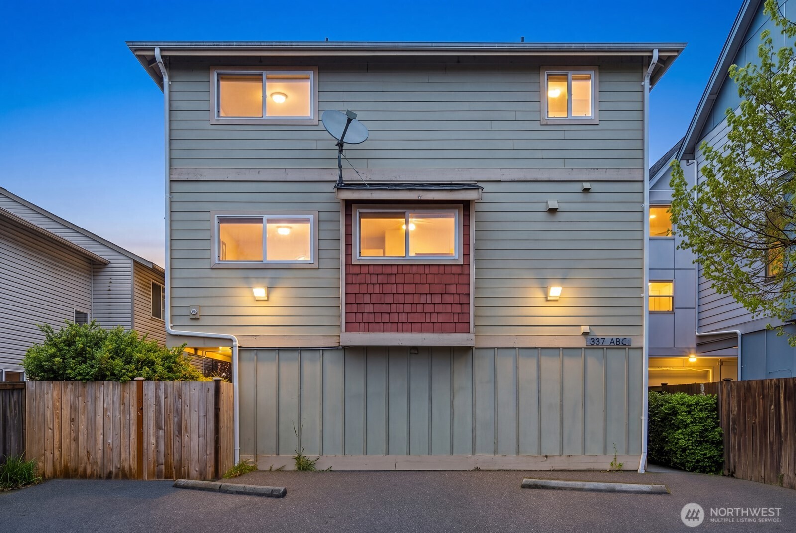 *Get 1% off your interest rate for the first year and a free full home warranty!* *Each bedroom has it’s own full bathroom!* Turn-key move in ready end-unit townhome with dedicated parking and a fully-fenced backyard in the heart of Greenwood! 3-unit community with no HOA. Close proximity to the Northgate lightrail and RapidRide transit. A wider-than-typical layout, tall ceilings, and open spaces create an airy, comfortable flow you don’t often find in Seattle townhomes. The entry level includes a flex bedroom / office with a full bath and its own separate back entrance—ideal for guests, work-from-home, or house-hack potential! Through the entry level you'll find a large, secluded, fully-fenced yard with code-equipped access. Enter in to the second level greeted by hardwood floors throughout the open concept living, kitchen, and dining spaces. Conveniently located powder room off the living area. The kitchen has a deep 1-piece sink, a gas range, bar seating, ample storage, modern appliances, and great prep space for daily living or hosting. On the 3rd and final level, you'll find the primary suite with a double vanity en-suite bathroom and strong natural light shaded between the mature landscaping and Juliet balcony. Fresh interior paint and new carpet make it truly move-in ready. Dedicated 1-car off-street parking right outside the front door provides everyday convenience. Easy commute to Downtown, the Eastside, and all Seattle has to offer. Pre-inspected! Don't miss it!