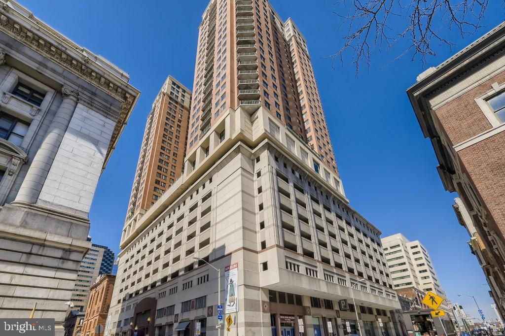 Short sale.  Fabulous Southern Water and City Views from level 28.  Wood flooring, granite counters, stainless appliances, gas fireplace, and parking in attached garage included.  Secure elevator building with 24-hour desk, parking attendant, on-site manager, rooftop two-level pool, gym, business center and party room.  Excellent downtown location a block and half from the water!  Split bedroom design.  Condo fee covers all utilities except electric.  Small cosmetic issues.  Needs paint and flooring repairs.   This corner unit is the most desirable floorplan with DIRECT water views from very high floor.   The value is in the height and view.  Select your own finishes.