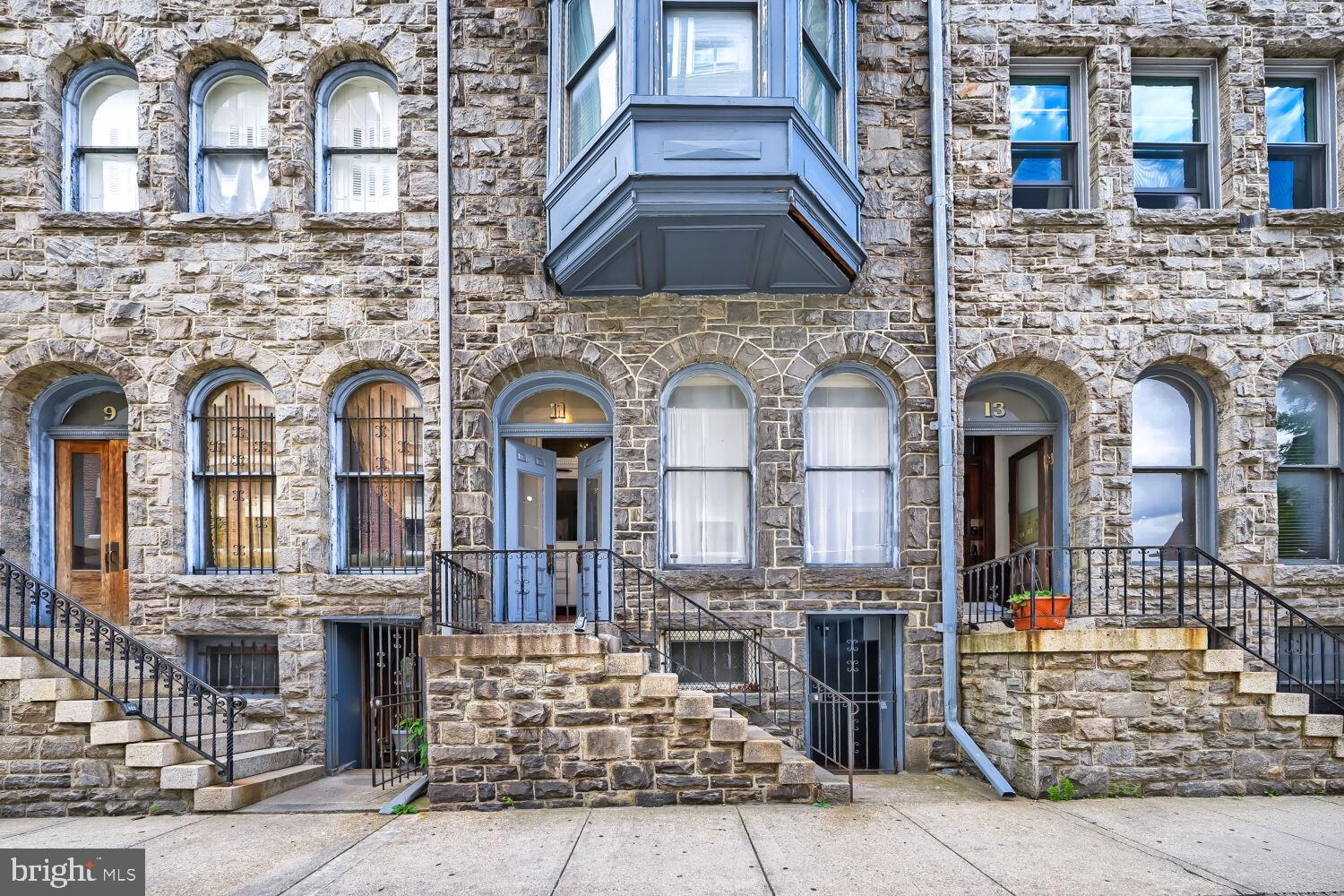 Welcome to Unit 11B at 11 W. Biddle Street, where historic charm meets modern sophistication in the heart of Mount Vernon. This beautifully updated pet friendly  residence features gleaming hardwood floors, soaring ceilings, abundant natural light, designer lighting, and an ethanol fireplace that creates a warm and inviting living space. Updated kitchen is designed for both everyday living and entertaining, offering stainless steel appliances, a timeless tile backsplash, generous cabinetry, and lots of workspace.Spacious bedroom with a bay window features a large walk-in closet. Previously updated bathroom . An in-unit utility room provides additional storage and the convenience of in unit laundry.Significant recent improvements include a new high efficiency HVAC system installed in 2025. Perfectly situated in one of Baltimore's most vibrant neighborhoods, you'll enjoy easy access to restaurants, cafés, museums, theaters, Penn Station, and everything Mount Vernon has to offer.Experience low-maintenance city living at its finest—simply move in and enjoy.