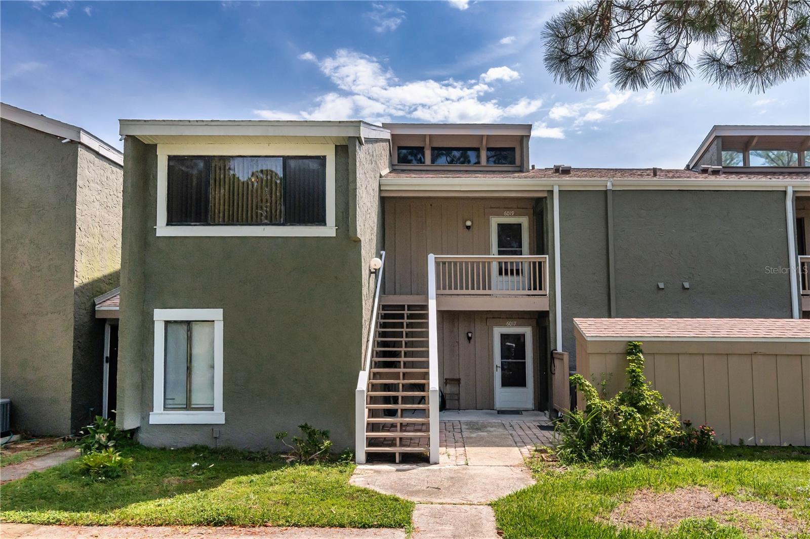 Excellent value on this 2BR/2BA water view home in the desirable Windhover Condominium community. Immaculate and move-in ready. BRAND NEW CARPET (July, 2025). The open living and dining areas provide a great view of all that you have out back– the community pool and neighborhood lake. Very desirable! Galley kitchen has a breakfast bar and is open to the dining area. Appliances included. Bedrooms located off the home’s hallway, with the primary suite in the back, so it also has that fantastic view. Here you’ll enjoy an ensuite bath and a walk-in closet with custom cabinetry. There’s also a screened lanai with pool view adjacent to the dining area  - another spot for relaxing or entertaining. Exterior storage room has your laundry facilities. HOA dues include access to the pool, clubhouse and tennis courts, and covers exterior maintenance, including roof replacement. There are many sidewalks within the community, too, ideal for walking enthusiasts. You are essentially across the street from Universal Studios property, and only 1 mile to your Publix and I4. Come see all that this special home has to offer. Great deal!