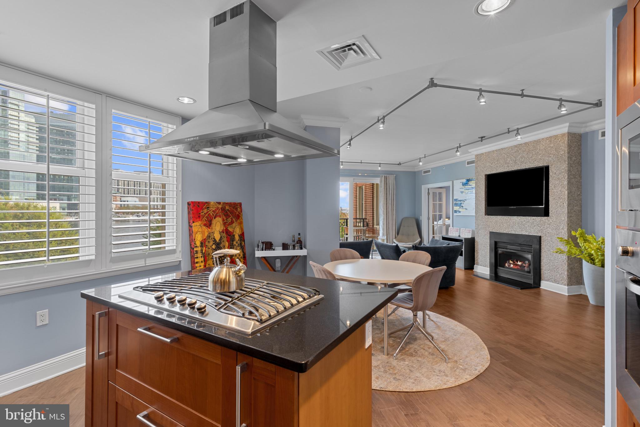 Sophistication meets serenity in this breathtaking one-bedroom, one-and-a-half-bath residence at The Ritz-Carlton Residences. Encompassing nearly 1,400 square feet, this remarkable home offers sweeping views of the main garden and harbor from every room. The private elevator opens directly into an elegant, open-concept living space where every finish has been carefully curated for both beauty and function. The designer kitchen boasts Viking Appliances and flows seamlessly into the dining and living areas.  A large private balcony off of the living room sits over the main garden and is perfect for morning coffee or evening escapes. The spacious primary suite features two generous closets and a spa-inspired bath. Included with the home are two deeded parking spaces and a separate storage area. With unmatched attention to detail and the ease of five-star amenities, this residence defines refined waterfront living. Building residents enjoy exclusive access to on-site fine dining, an onsite marina, and a state-of-the-art medical and wellness spa, along with 24-hour concierge, valet, doorman, and porter services that exemplify The Ritz-Carlton standard. Additional lifestyle amenities include an indoor pool, fitness center, theater, six private guest suites, and elegantly appointed entertaining spaces set among manicured gardens. Perfectly positioned on the Baltimore Promenade with direct access to the waterfront, water taxis, and cultural landmarks, this home is minutes from the city’s vibrant art scene, stadiums, Penn Station, and BWI Airport. Schedule your private showing today.