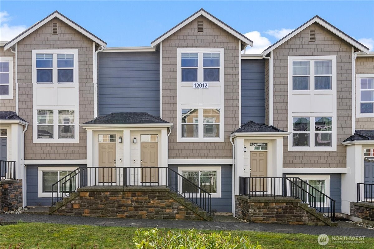 Better than new and move-in ready, this beautifully maintained 2024-built 3 bed / 3 bath, 1,696 sq ft townhome in Preston North Townhomes offers modern comfort and style in a charming community with a neighborhood park and ample guest parking. This light-filled home offers excellent privacy and is thoughtfully designed for both everyday living and effortless entertaining. Expansive windows and a covered deck invite abundant natural light, perfectly complementing the warm wood flooring and creating an inviting space ideal for relaxing or hosting guests. The sleek kitchen features quartz countertops, a stylish backsplash, and GE Cafe SS appliances perfect for cooking and gathering. Upstairs, the spacious owner’s suite includes a walk-in closet and spa-inspired bath with dual vanities, while a generously sized secondary bedroom features its own ensuite bath. A conveniently located laundry area completes the upper level. The lower level offers a versatile third bedroom providing flexible living space, ideal for a guest suite, media room, home gym, or work-from-home-ready office. Additional highlights include high-efficiency mini-split A/C, custom closets, an electric vehicle charger, designer window treatments, and a spacious side-by-side two-car garage. Located in the highly acclaimed Northshore School District and a prime North Creek location near dining, parks, YMCA, and easy access to I-405. Better than new, light-filled, and move-in ready, Welcome Home!