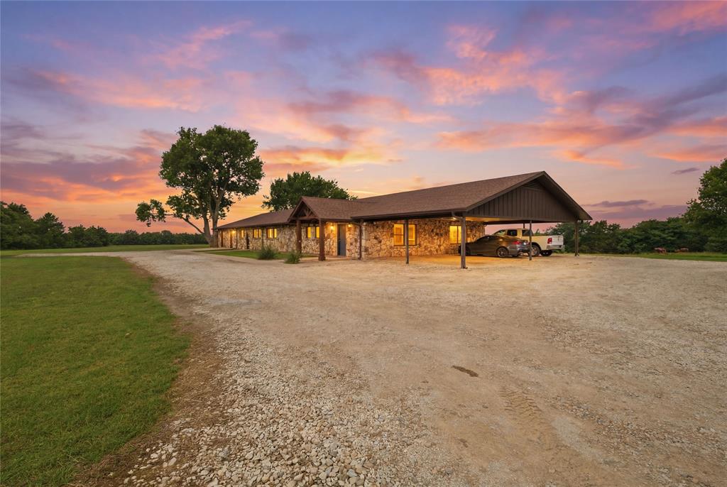 Exceptional multi-use commercial property offering endless possibilities just outside the city limits with no zoning restrictions! Situated on 8 acres with over 870 feet of Highway 377 frontage, this impressive approximately 4,000-square-foot stone building is ideally positioned for a wide variety of commercial, investment, or live-work opportunities. The property features 2 different types of spaces under one roof. The office portion offers three private offices, a spacious conference room, two bathrooms, flex space and a large garage for storage. The income producing residential portion offers 2 bedrooms, 1 bathroom, full kitchen, and multiple flexible workspaces. This arrangement makes it ideal for an owner-occupant, on-site manager, rental income, or employee housing. Outside, you’ll find two stocked ponds, fenced yard, two water wells for irrigation, co-op water, and plenty of room for expansion or additional business operations. The building offers spray foam insulation along the roofline for energy efficiency, a security system with cameras, and a new roof has recently been installed, providing added value and peace of mind. Conveniently located just minutes from Lake Texoma, area marinas, casinos, and wineries, this highly visible property offers exceptional accessibility and outstanding potential for professional offices, medical, event venue, retail, contractor headquarters, hospitality, mixed-use development, or countless other business ventures. With premium highway frontage, acreage, and no city zoning restrictions, opportunities like this are truly hard to find.