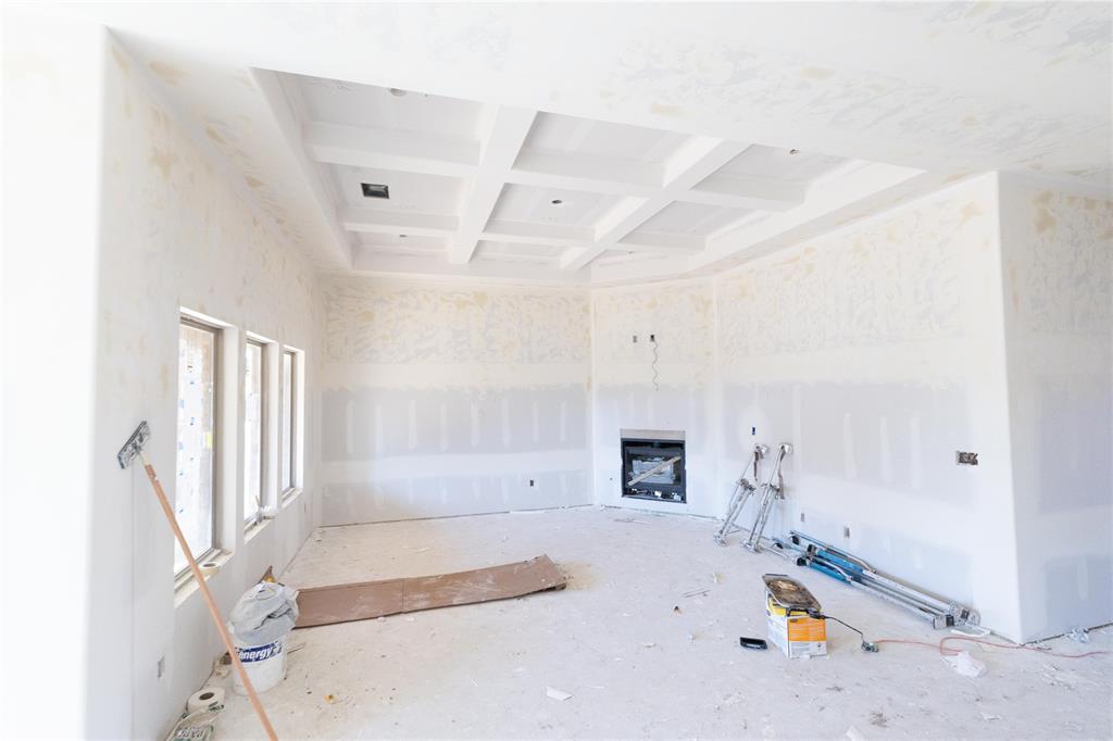 This Kamber floor plan includes 1,905 Sqft of total living space, which includes 1,750 Sqft of indoor living space and 155 Sqft of outdoor living space. This charismatic home offers 3 bedrooms, 2 full bathrooms, covered patios, a utility room, and a 2-car garage with an in-ground storm shelter installed. The living room presents a coffered ceiling with a ceiling fan, wood-look tile, a corner gas fireplace surrounded by our elegant stacked stone detail, Cat6 wiring, and 3 large windows. The high-end kitchen supports a large center island, stunning pendant lighting, custom-built cabinets to the ceiling, stainless steel appliances, decorative tile backsplash, 3 CM countertops, and a large walk-in pantry. The large primary suite spotlights a sloped ceiling detail with a ceiling fan, windows, and our cozy carpet finish. The prime bath offers a free-standing tub, a dual sink vanity with framed mirrors, a walk-in shower, a private water closet, and a HUGE walk-in closet! The covered outdoor living supports a wood-burning fireplace, a gas line, and a TV hookup. Other amenities include our healthy home technology, a tankless water heater, R-44 insulation, a whole home air filtration system, and so much more!