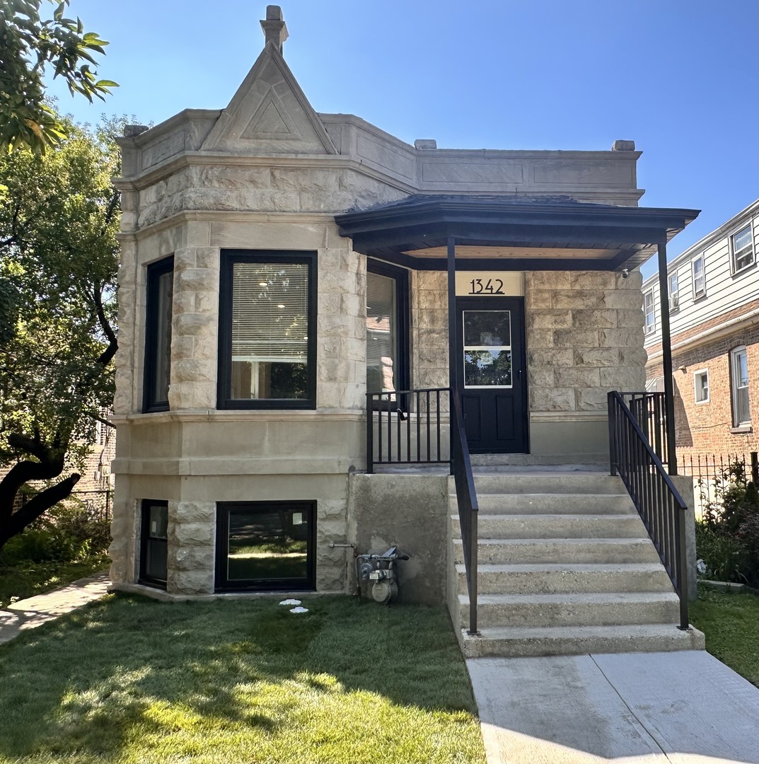 Full Gut Rehab - Stunning Greystone with 4 Bedrooms & 3 Baths!   Welcome to this beautifully restored stunning greystone, offering the perfect mix of historic charm and modern luxury. Featuring 4 spacious bedrooms and 3 full bathrooms, including a master suite with private bath and walk-in shower, this home is designed for both comfort and style. The heart of the home is the open-concept kitchen with a 9-foot island, custom cabinetry, quartz countertops, and stainless steel appliances-ideal for entertaining. The sun-filled living room flows seamlessly from the kitchen, complete with a wall-mounted smart TV and electric fireplace for cozy evenings. The finished walk-out basement expands your living space with a large family room, 2 additional bedrooms, and a full bath with stand-up shower-perfect for guests or extended family. Step outside to enjoy the large yard and benefit from the convenience of a 2.5-car garage. Everything is brand new for peace of mind-New HVAC, electric, plumbing, and copper water main line! This home truly has it all-modern design, thoughtful layout, and top-to-bottom upgrades. Move right in and start making memories!