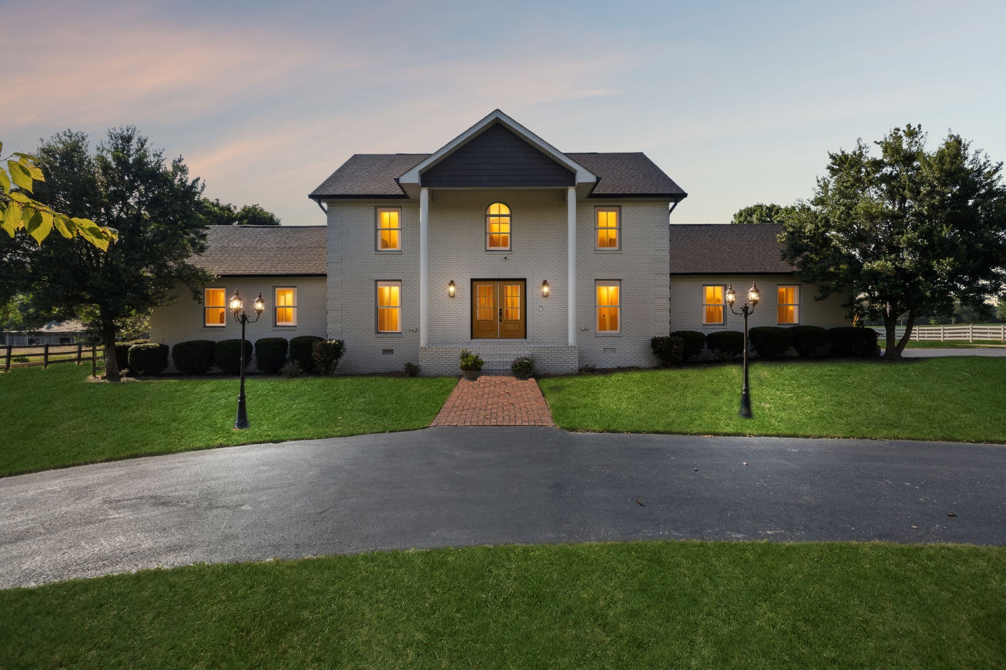 Discover the rare opportunity of owning this completely renovated 7.2 acre exceptional estate at 3935 Harmony Grove Road in picturesque Hopkinsville, KY. Your dream country retreat just a short drive to Hopkinsville or Lake Barkley, you can't beat this location! Walking in from the covered front porch you are greeted with an entry foyer leading to a vast open floor plan with exquisite views from every window. Encompassing approximately 3,440 square feet, this home is refined with top tier craftsmanship and modern luxury design. Featuring 5 spacious bedrooms and 3 luxurious bathrooms, it offers both space and style. Step into the gourmet kitchen, a chef's dream with designer lighting, custom cabinets, tile backsplash, granite countertops, farmhouse sink, a 6-burner gas range, double ovens and an expansive island complete with top-of-the-line stainless steel appliances. The open layout seamlessly connects to a living area adorned with an oversized fireplace and gleaming, sanded and finished hardwood floors. Retreat to the primary suite offering an expansive double walk-in closets, a stunningly renovated bathroom with dual vanity, separate freestanding bathtub and a beautifully tiled shower with frameless glass door, along with access to private deck vistas of the stunning 16 x 32 in-ground pool. The property boasts additional indulgences including a spacious utility room and tankless water heater. Spread across a generous 7 acres, the estate features four-board fencing ideally suited for horses, livestock, or farming with a picturesque pond, a barn with four stalls, and a five-bay utility shed. Enjoy the convenience of a long circular driveway, ample parking and a two car garage. Whether entertaining or relaxing, this home is a sanctuary where every detail has been thoughtfully designed to offer the very best in luxury living. This private estate is truly one of a kind in every way. Don't miss the opportunity to own a piece of paradise in the heart of Southwestern KY.