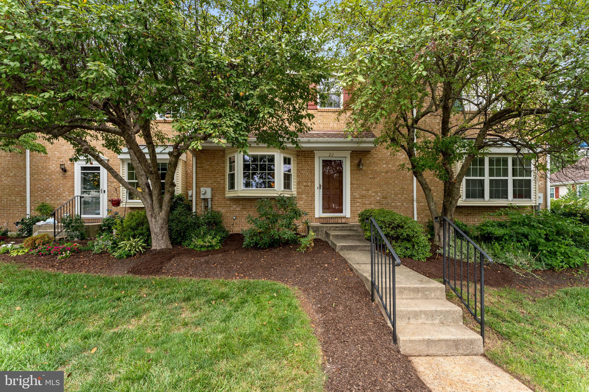 Enjoy easy living in this low-maintenance townhome in the popular Chandlers Crossing community in Boyertown! A welcoming living room features beautiful bamboo flooring, a bay window, coat closet, and a cozy corner fireplace that serves as the focal point of the space. The adjacent dining room, with the same bamboo flooring, flows seamlessly into the kitchen, offering 42-inch soft-close white cabinetry, a stylish tile backsplash, double oven with smooth-top range, built-in microwave, and dishwasher. A convenient powder room completes the main level. Step outside through the sliding glass doors to a generously sized deck overlooking a peaceful tree line—the perfect setting to enjoy your morning coffee or unwind at the end of the day. Upstairs, the primary suite features a vaulted ceiling, double closets, and a private ensuite bath with a double-bowl vanity, tile flooring, and walk-in shower. Two additional bedrooms, a full hall bath, and a linen closet complete the second floor. The finished walk-out lower level expands your living space with luxury vinyl plank flooring, a dedicated laundry area, and ample storage. Sliding doors lead to a patio, creating another inviting outdoor space to relax or entertain. Ideally located near the new Lehigh Valley Hospital in Gilbertsville, major commuter routes, and just minutes from downtown Boyertown's shopping, restaurants, and community events. You'll also enjoy nearby Boyertown Municipal Park, offering walking trails, athletic fields, and a dog park. Welcome to 22 Stafford Square—a wonderful place to call home!