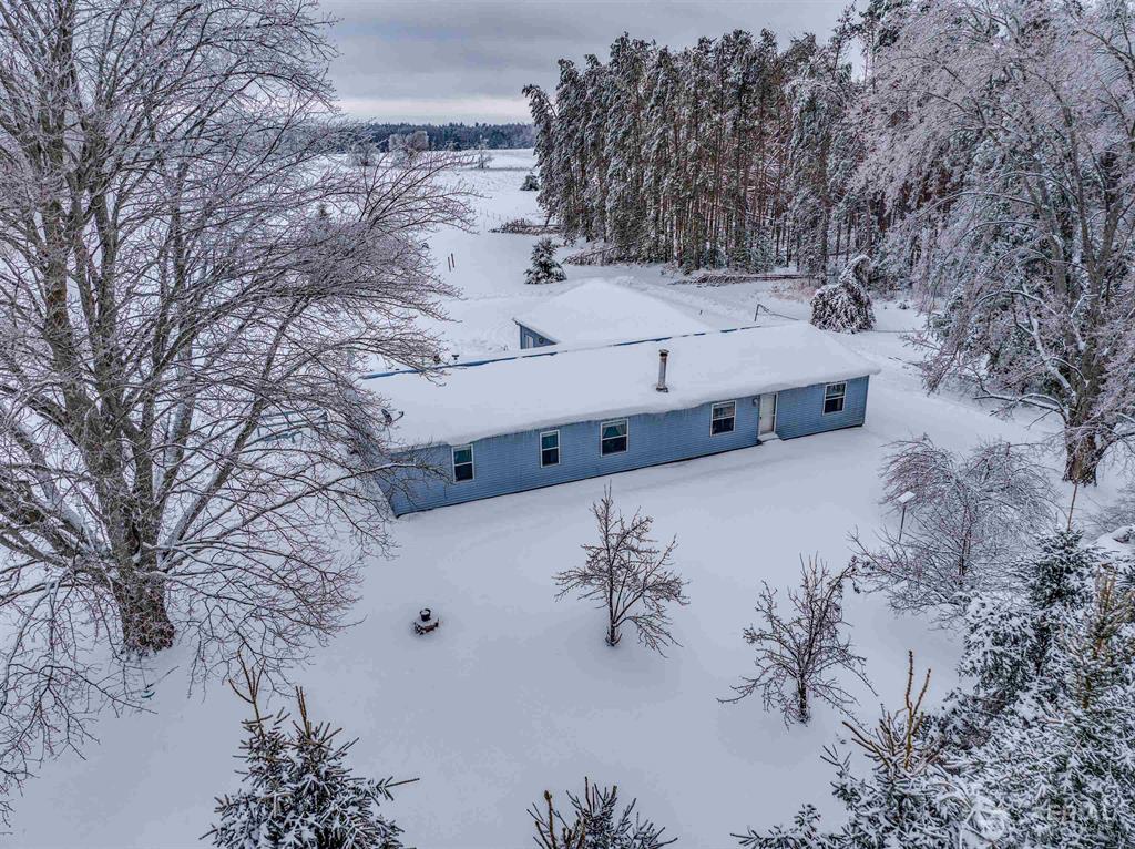 Are you looking for a peaceful, private setting? This is it! This charming 3-bedroom home sits on 10.20 acres, offering plenty of space to enjoy country living. The property includes a 30x40 pole building-perfect for storage, hobbies, or equipment. Ideal for horse enthusiasts, gardening, or anyone seeking a quiet rural lifestyle, this home features a durable metal roof, central air, and a spacious kitchen complete with a pantry and island. Step outside onto the large back deck and take in the beautiful views!