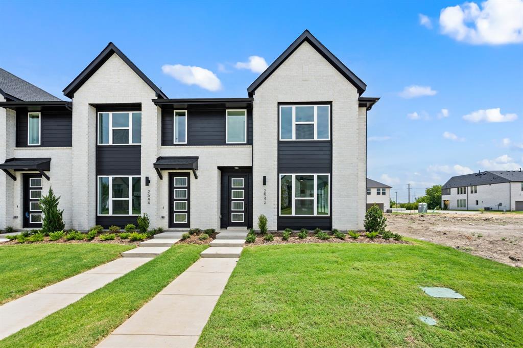 CADENCE HOMES ALEXANDER floor plan.  Beautiful, two story, modern elevation in this stunning end unit, lock & leave home! Inside you'll discover a private foyer, an open living room-dining-kitchen area designed for entertaining paired with a pocket office featuring built in desk & storage perfect for the professional needing to work from home. The main level features Mohawk Revwood plus engineered wood flooring with upgraded tile and gorgeous 3cm quartz countertops in the chef's kitchen! The cabinets feature soft close hardware, cabinet pulls, crown molding, pot & pan drawers, and a pullout trash can. Upstairs you will find a spacious owner's suite, 2 nicely sized secondary bedrooms and a huge loft...perfect for a second family living space or playroom. The utility room is located upstairs for your convenience. The oversized 2 car garage offers extra space for storage. Easy access to 121 and 75 and located across from a massive new mixed-use development, Sloan Corners, offering future restaurants, shops, and over 50 acres of park space and water features.  Sloan Corners is from the same developer that built Austin Ranch in Carrollton and Cypress Waters in Coppell. This home is complete and ready to call home in the Allen ISD!